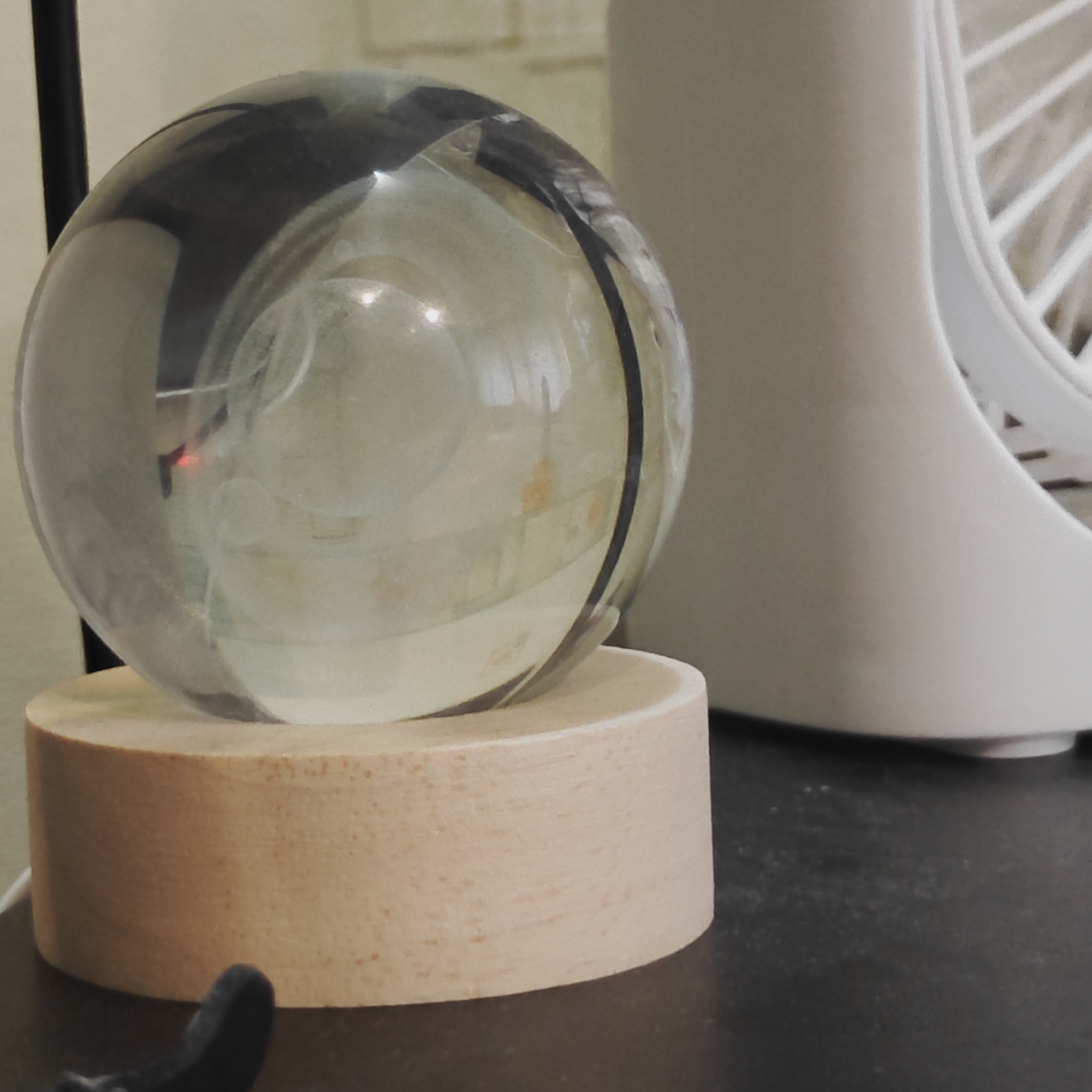 Close-up product shots of crystal Saturn spheres and wristwatches