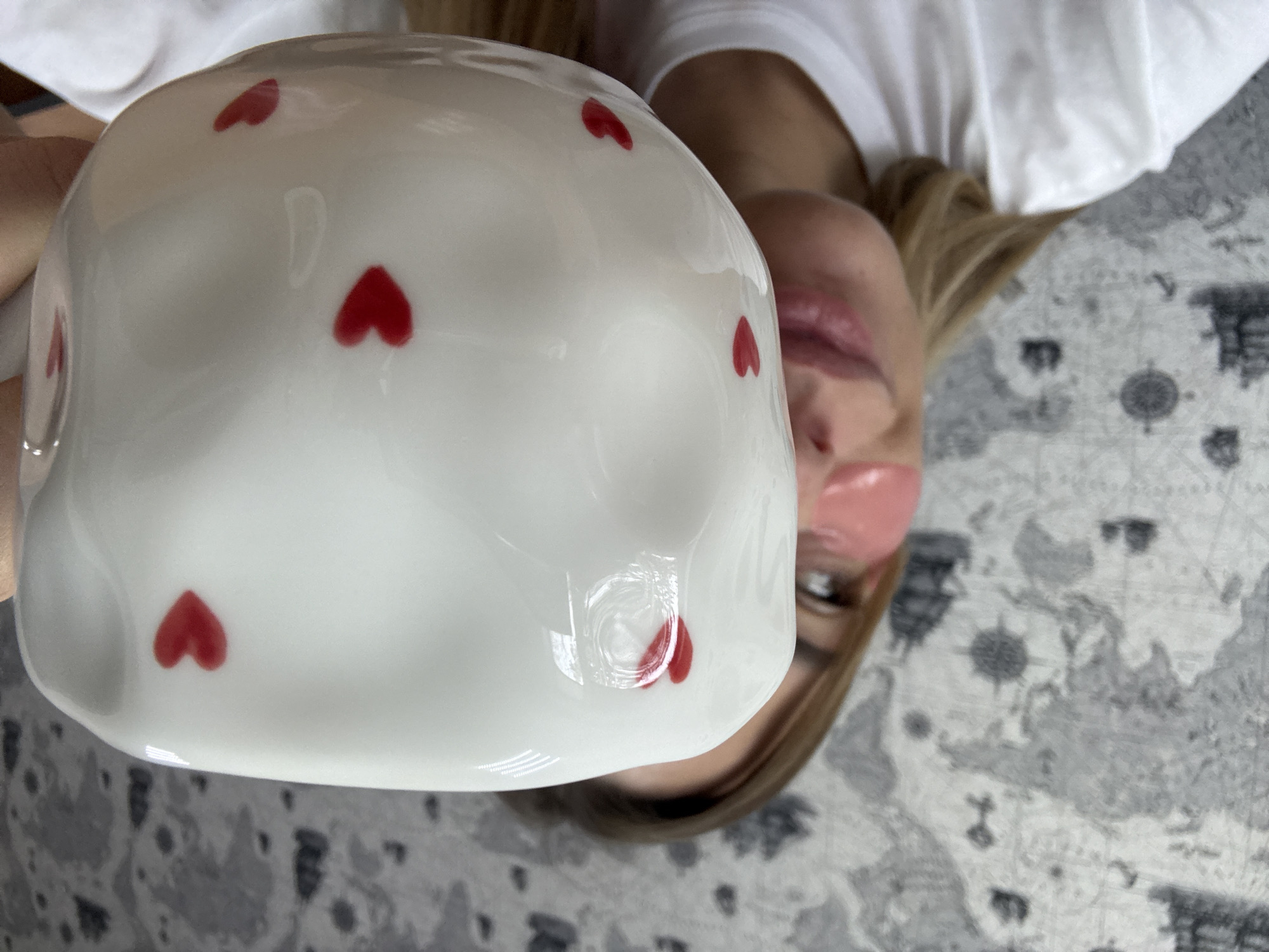 Woman relaxes with skincare routine and hot beverage in Russia