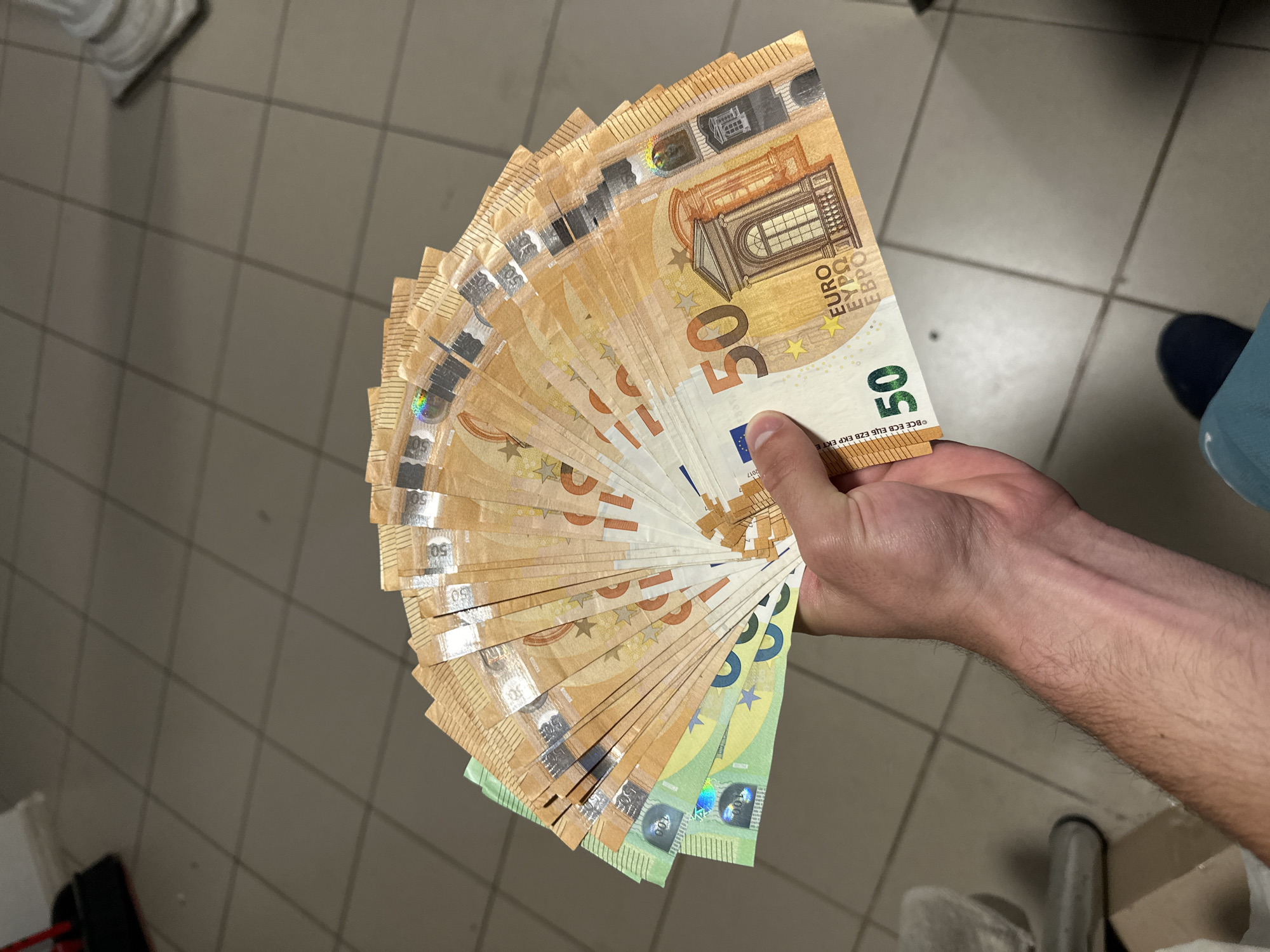 Evening money display and street activities documented in Ivailo, Bulgaria