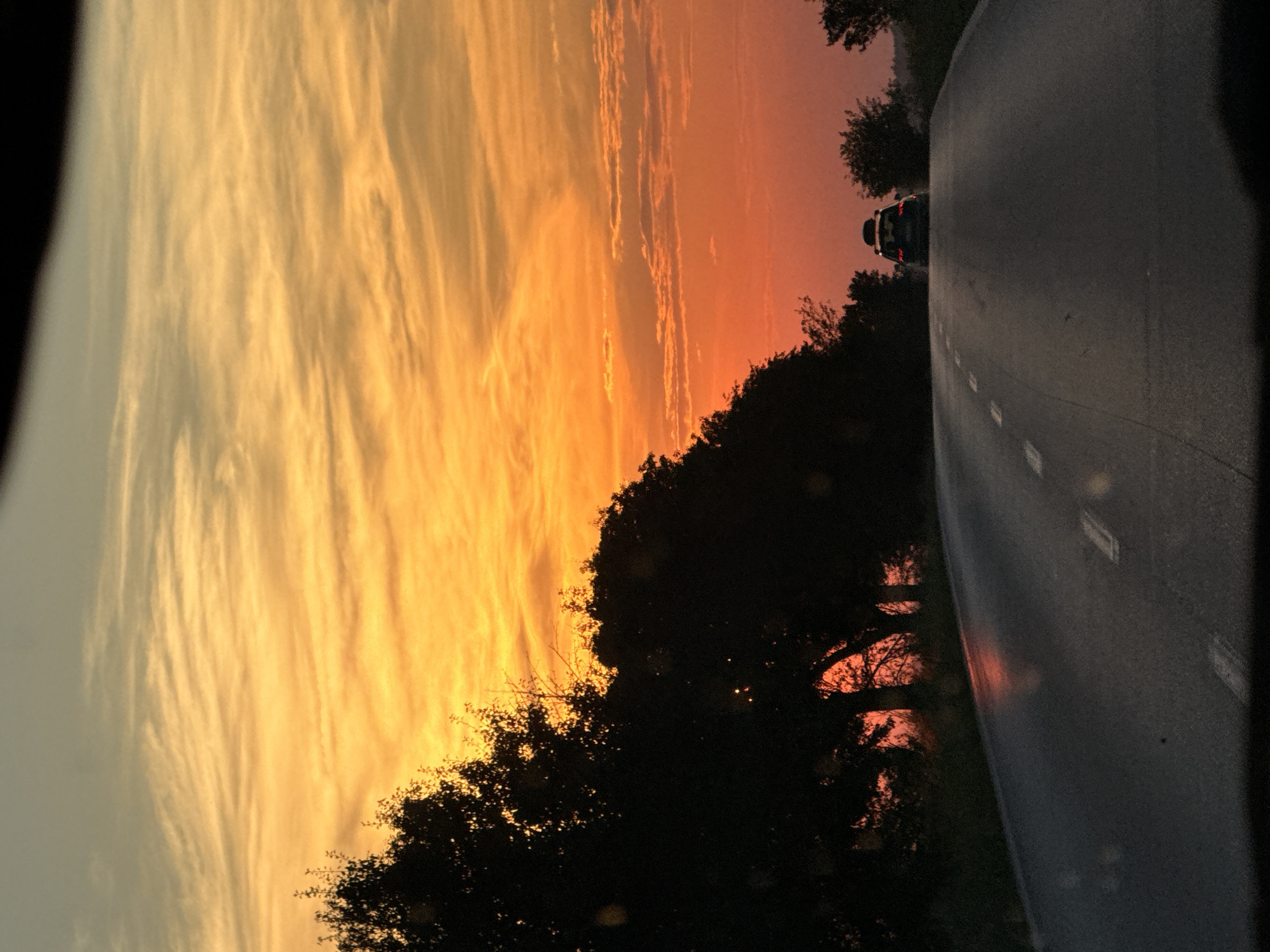 Fiery Bulgarian sunset through a windshield near Zgalevo