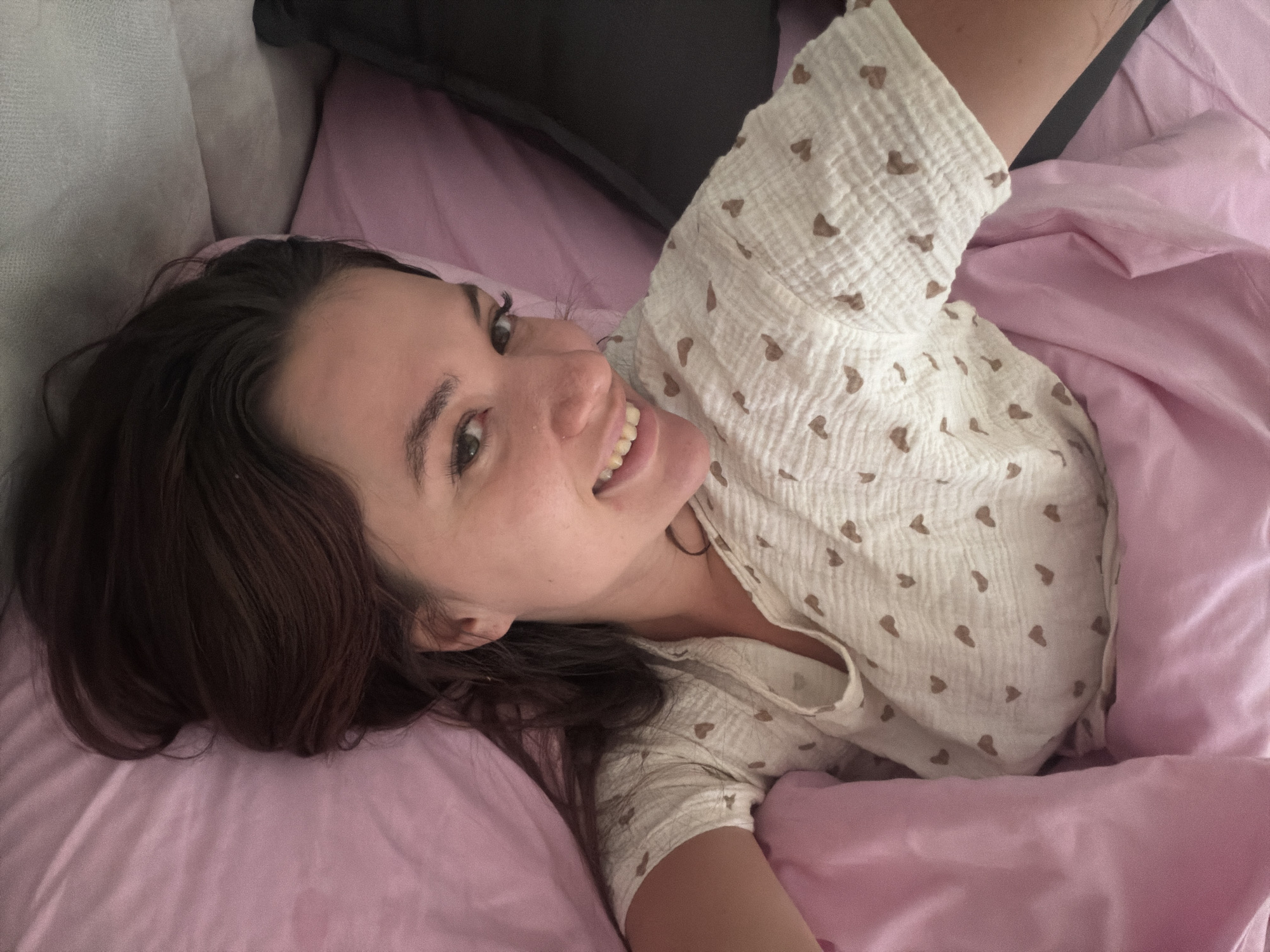 Morning bedroom scene with young woman and cat in Belgrade