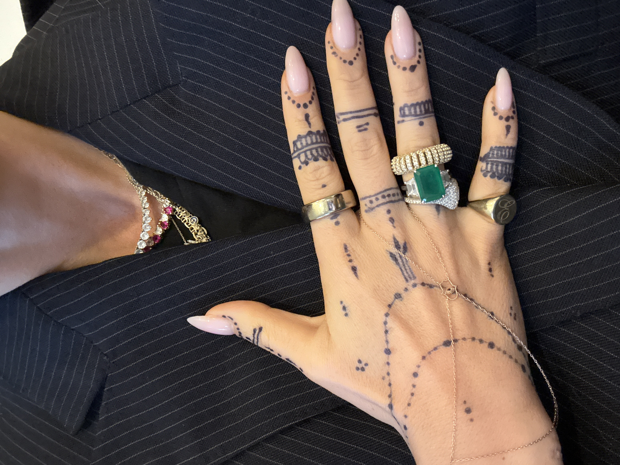 Woman shows off henna tattoos and rings in London