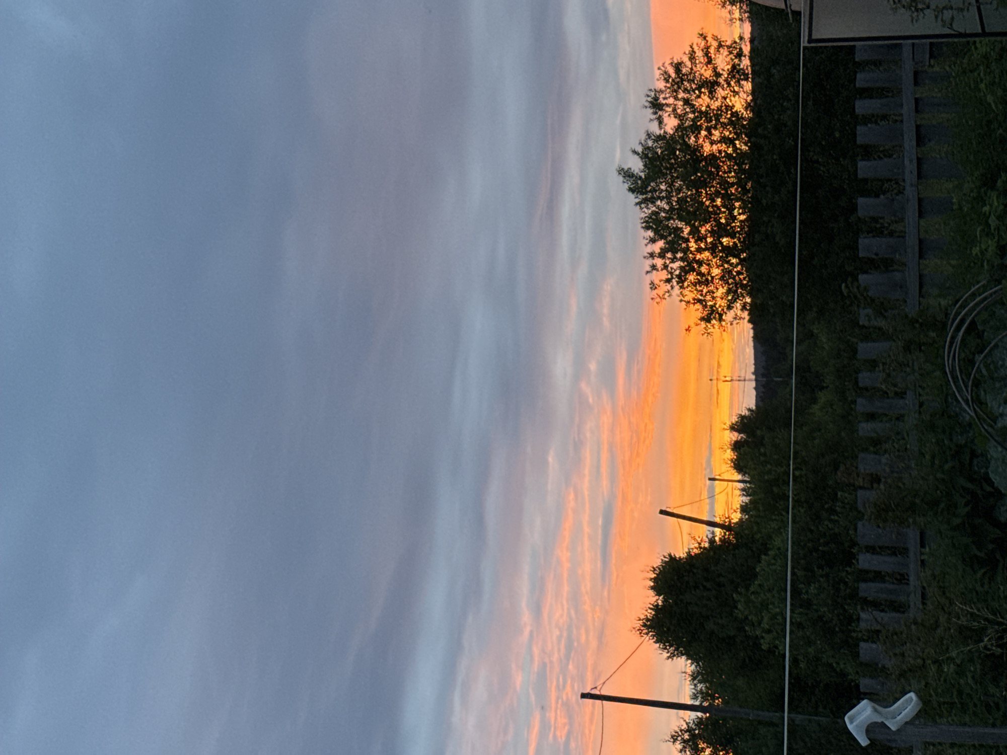 Sunset and flowering trees in rural Garevaya, Russia