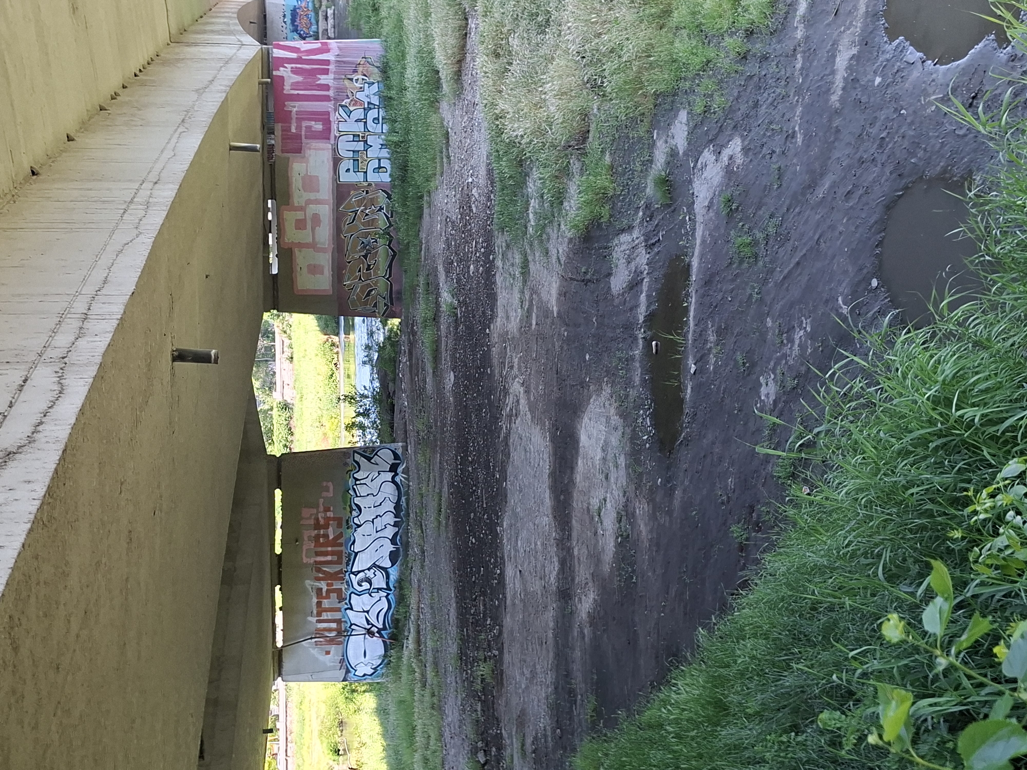 Urban scenes documented in Plovdiv: graffiti underpass, sunny sidewalk