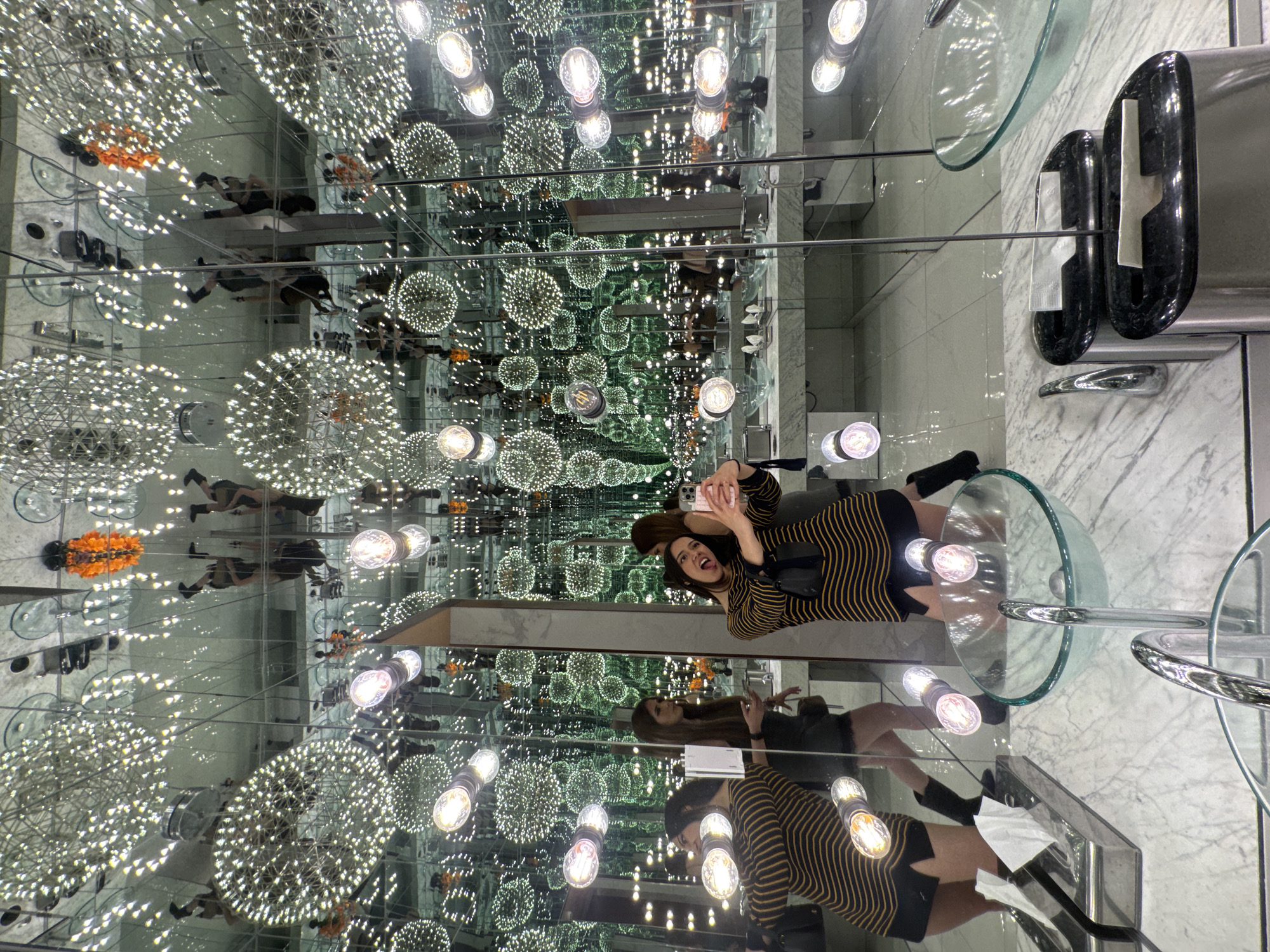 Visitors capture selfies in infinity mirror room in Puebla
