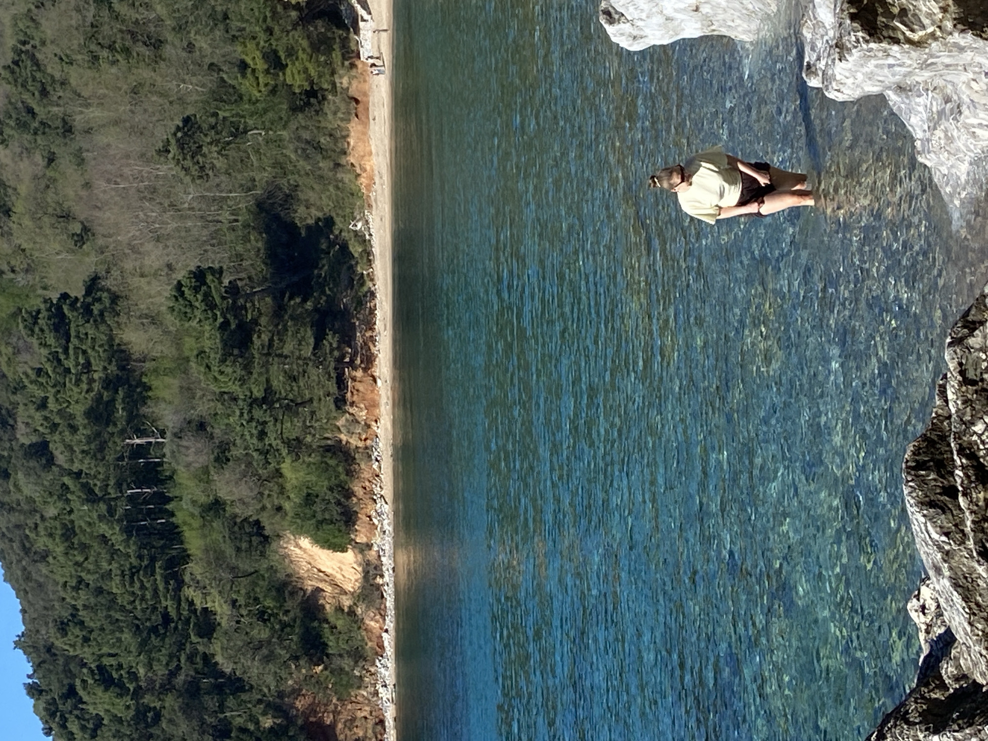 Morning beach activity captured along Montenegro's rocky Budva coastline