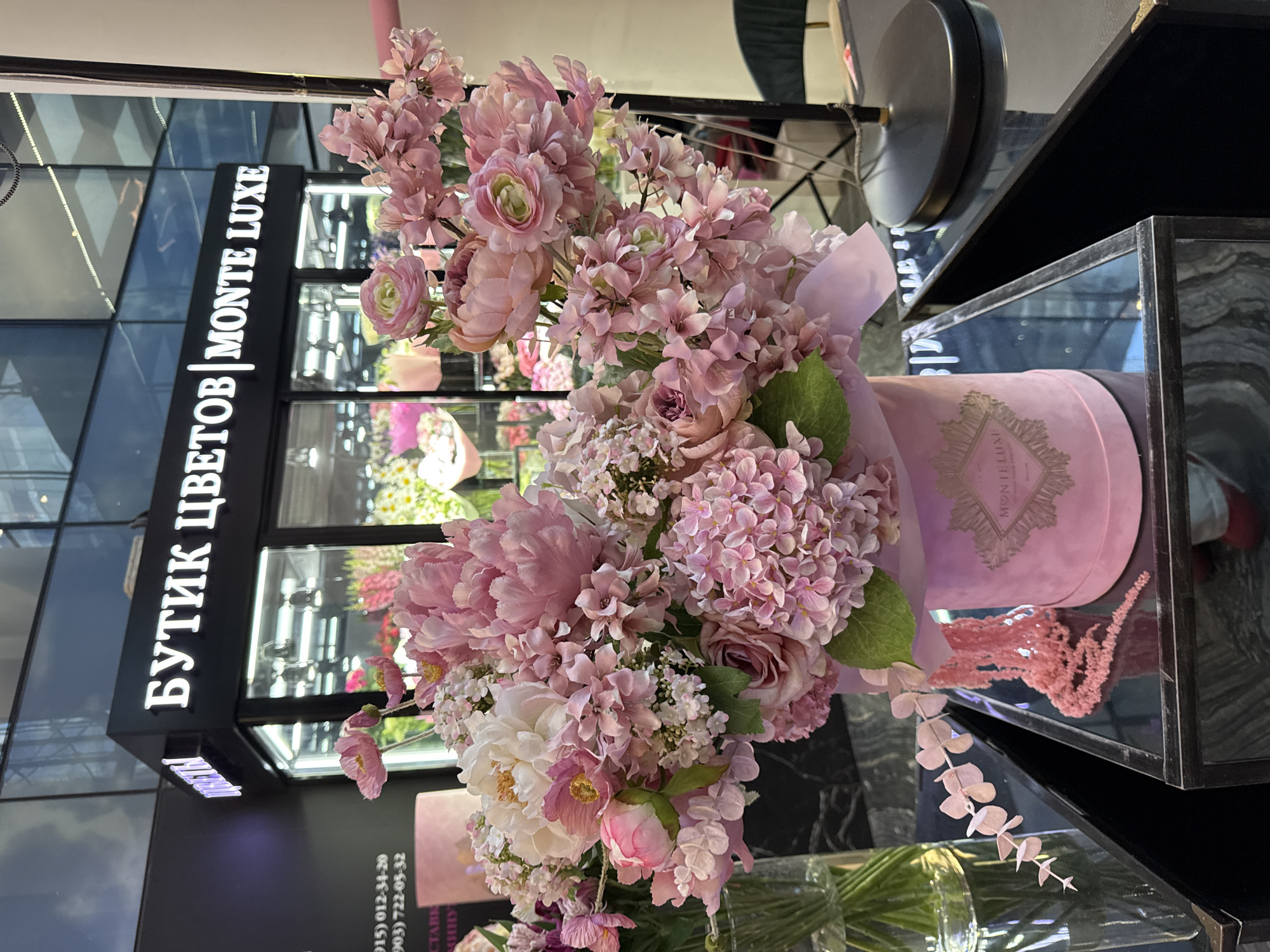 Elegant pink and white floral display spotted at upscale boutique