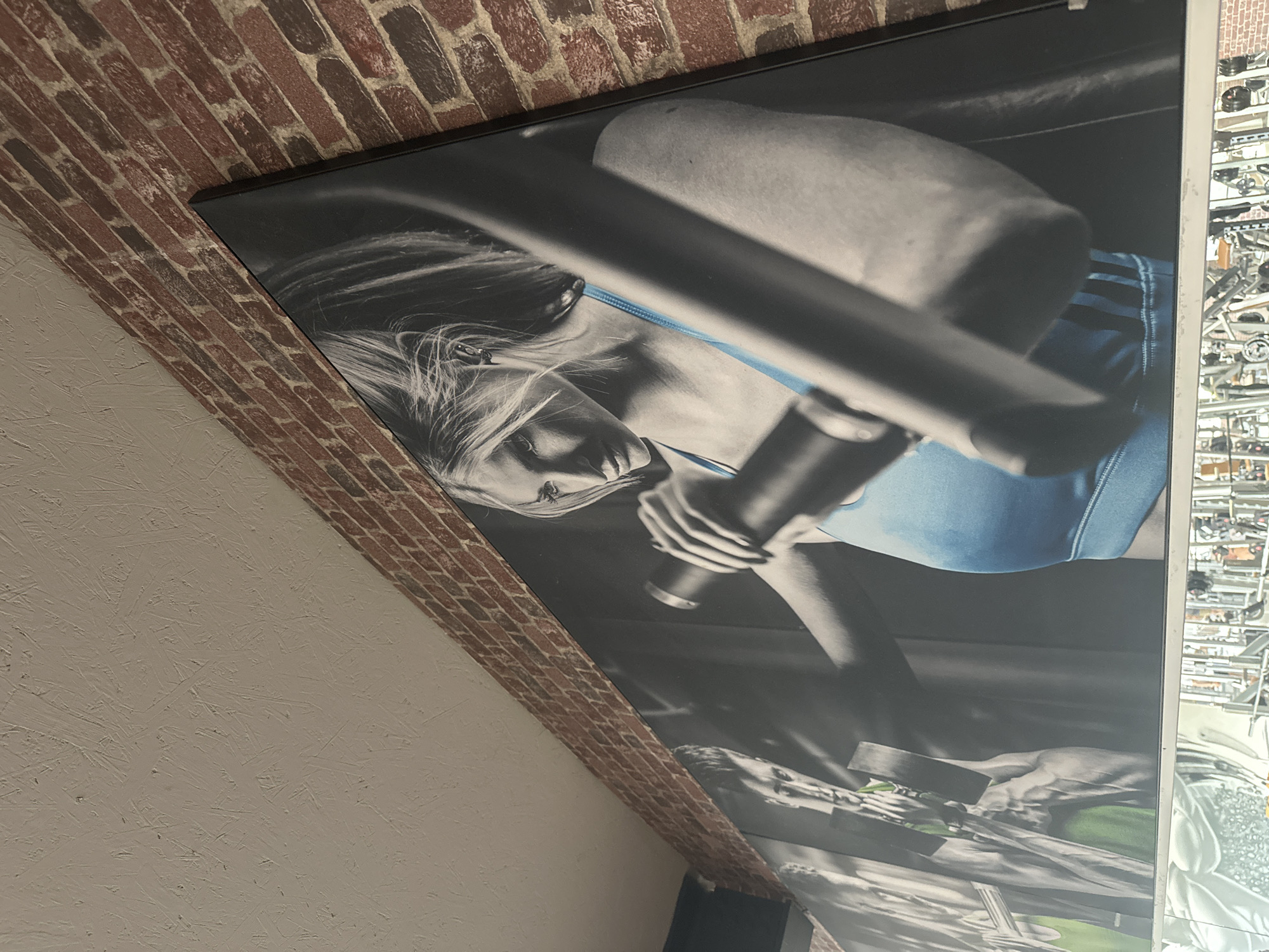Fitness poster with blue accent spotted on Brunnthal wall