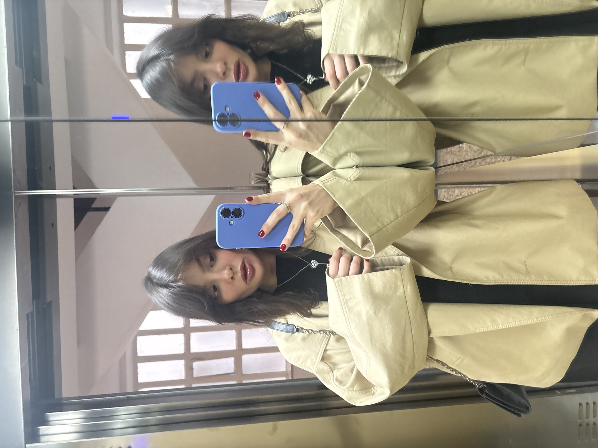Woman takes mirror selfie in Santiago de Compostela