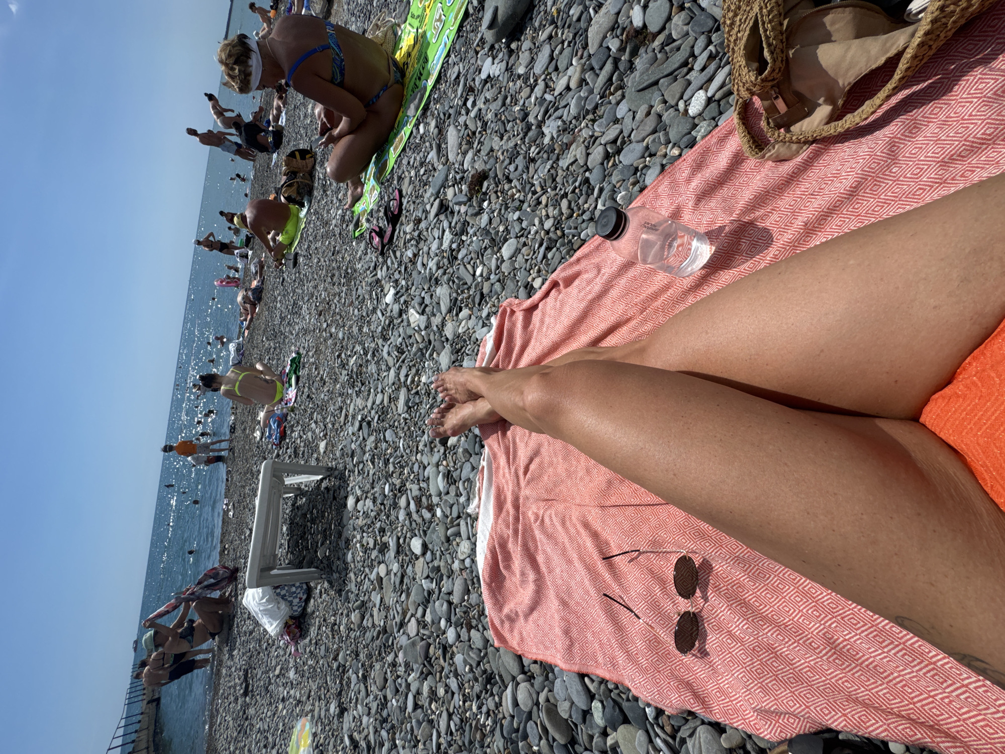 Busy summer day on Sochi's pebble beach