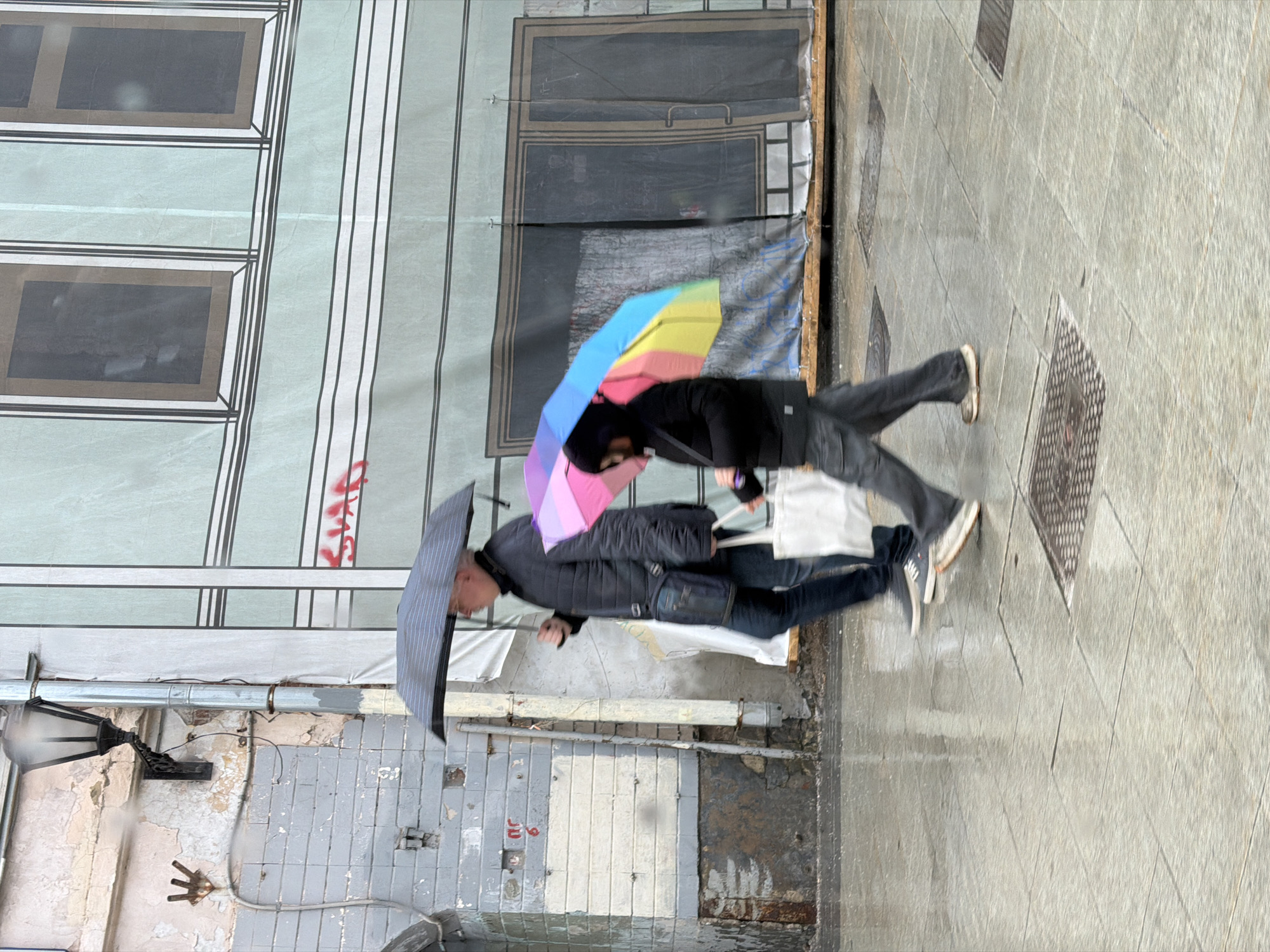 Rainy afternoon scenes documented across Moscow locations