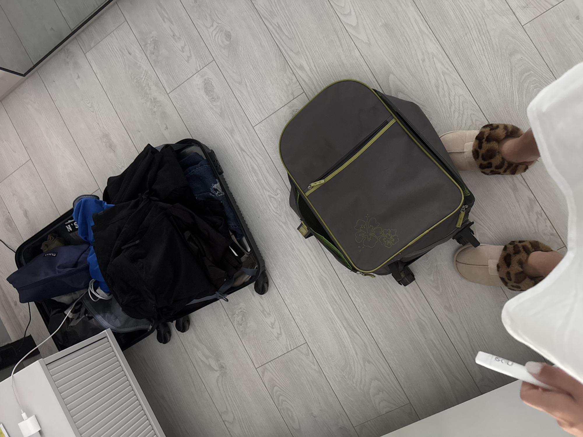 Young woman documents morning travel preparations in Sofia bedroom