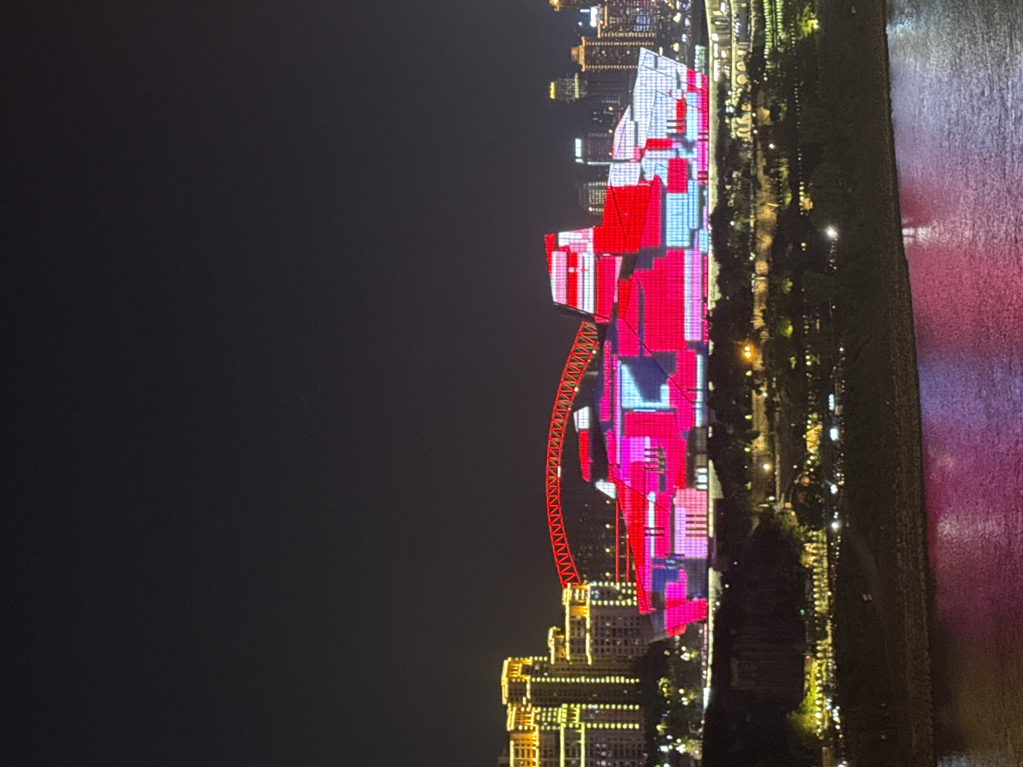 Chongqing's illuminated skyline and bridges captured during afternoon hours