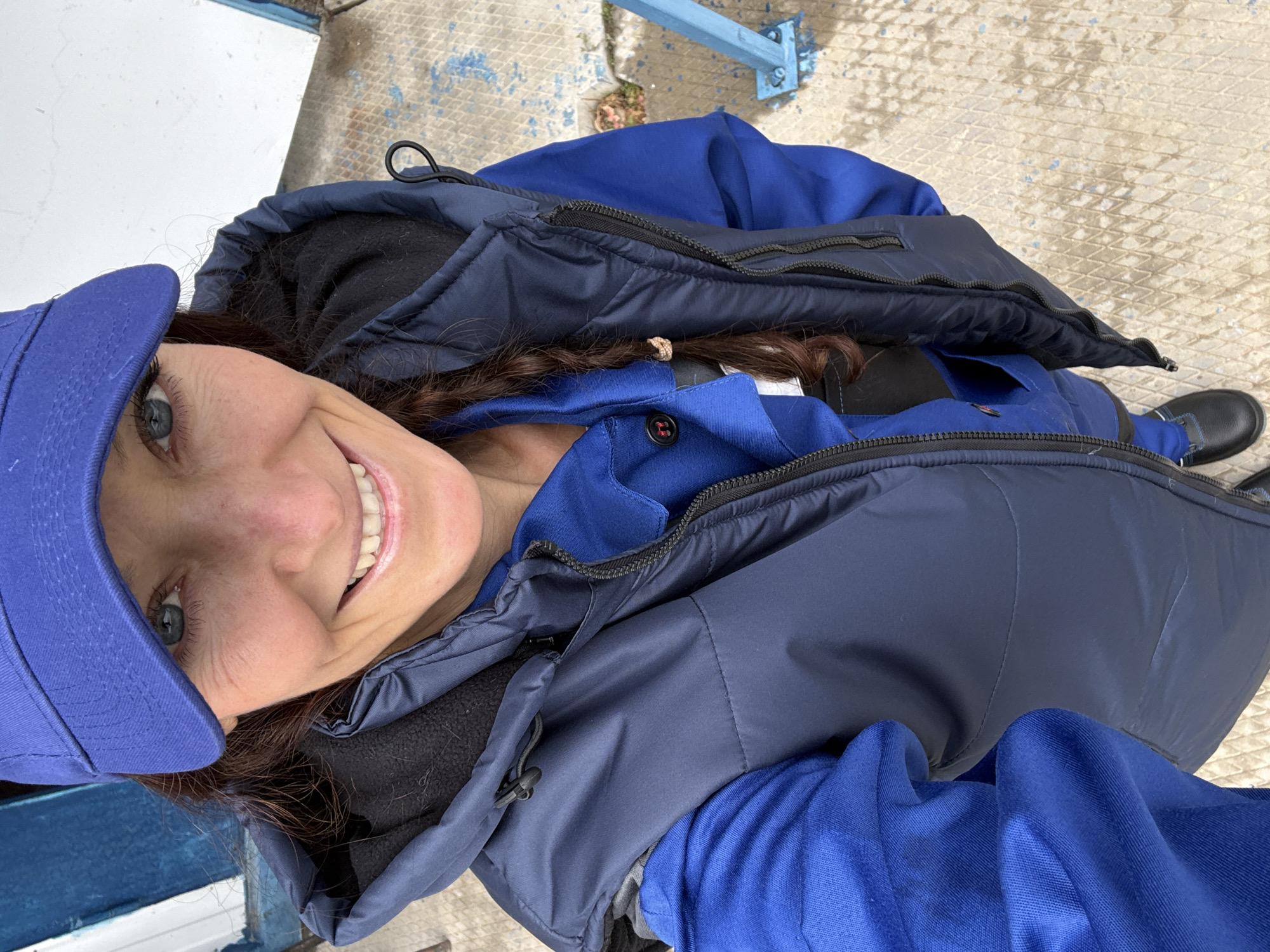 Worker in blue uniform documented throughout afternoon in Chaika, Ukraine
