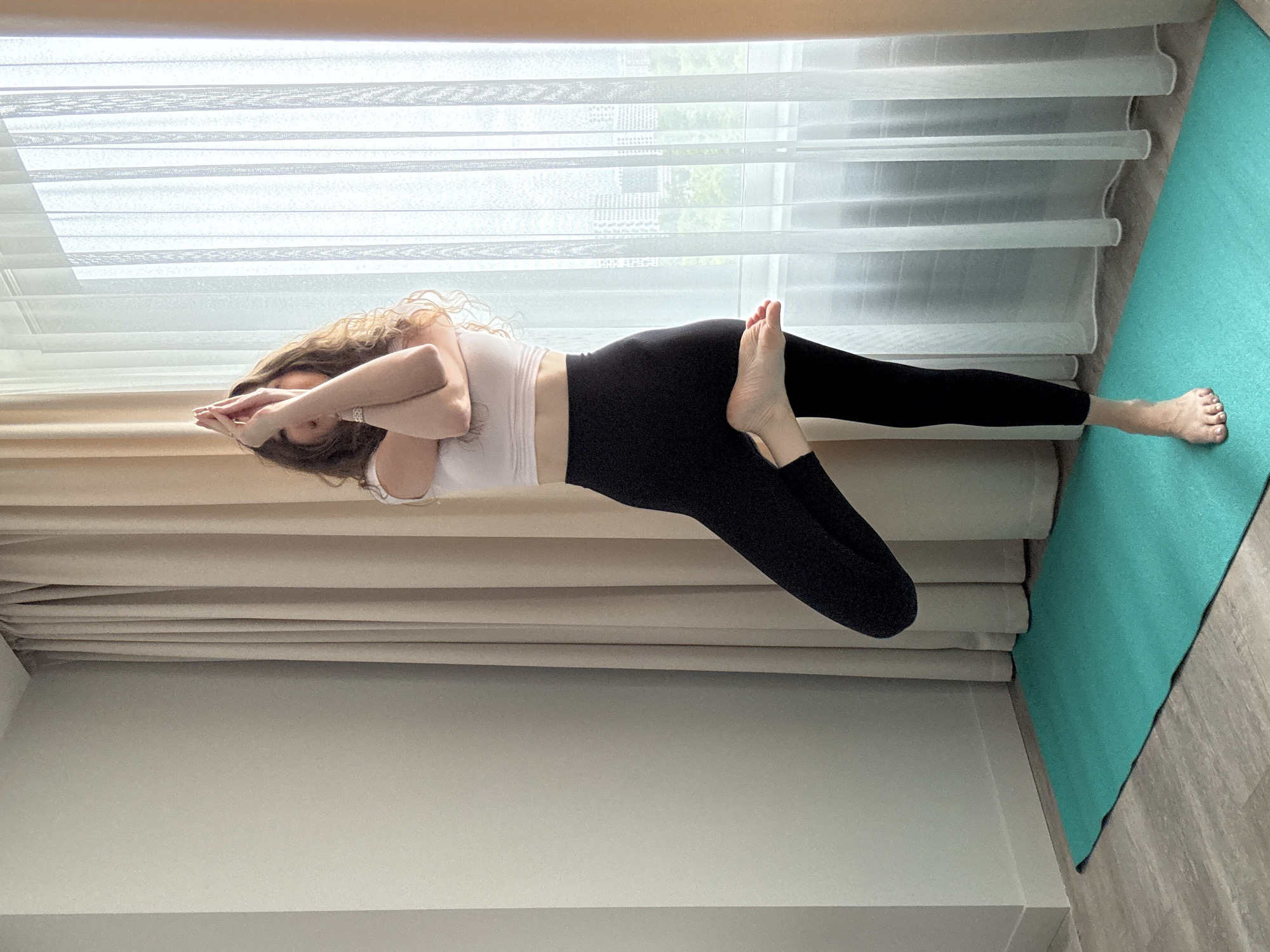 Yoga practice session with multiple poses on teal mats