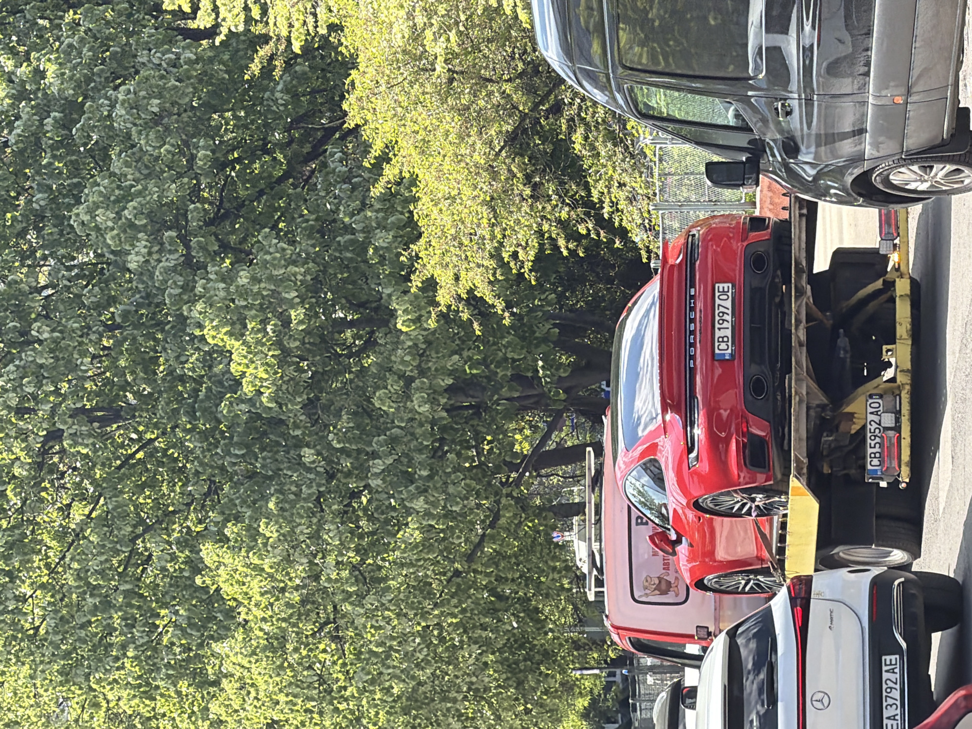 Red Porsche towed on Sofia street