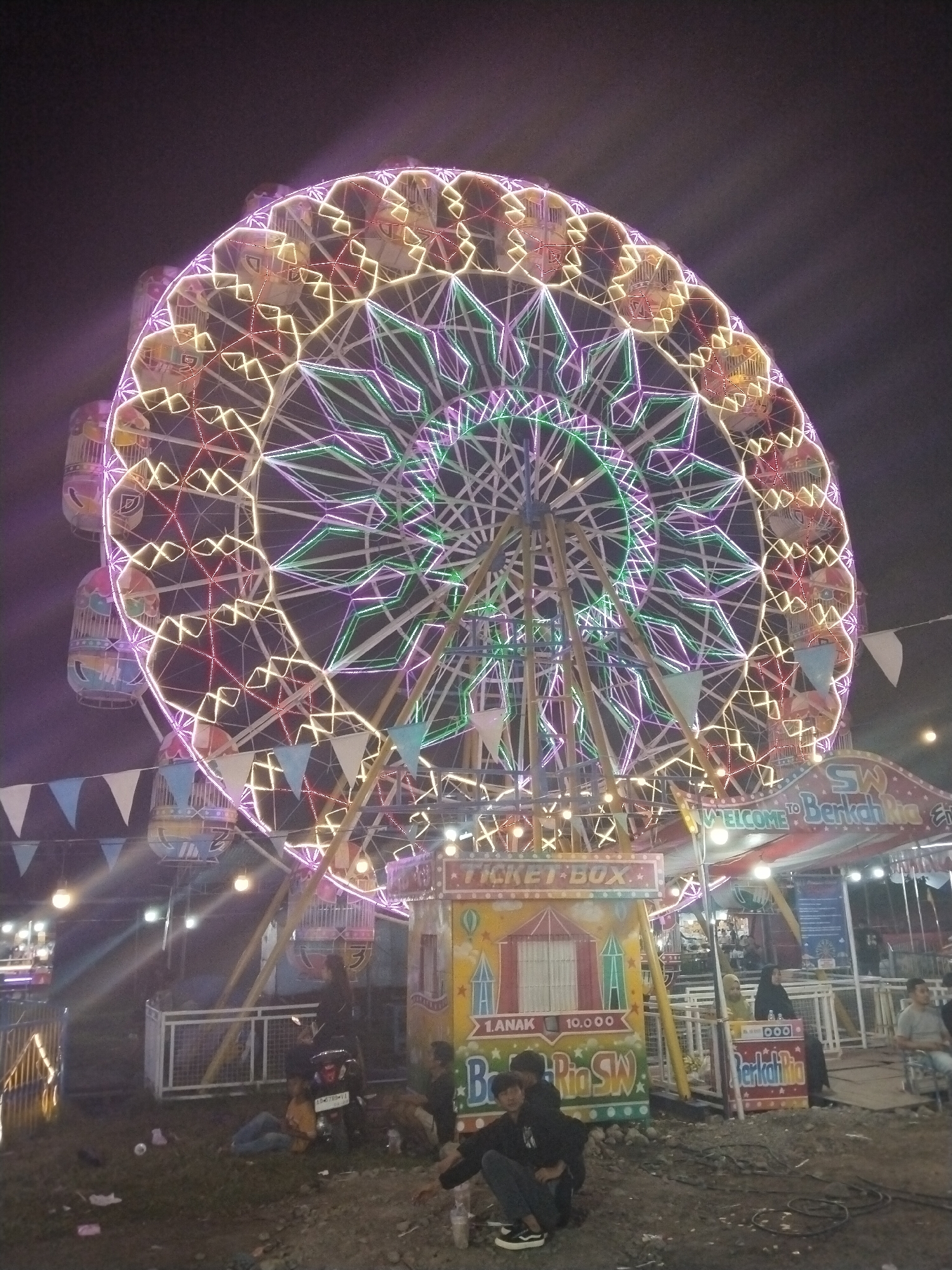 Evening carnival activities captured at Sragen fairground, Indonesia