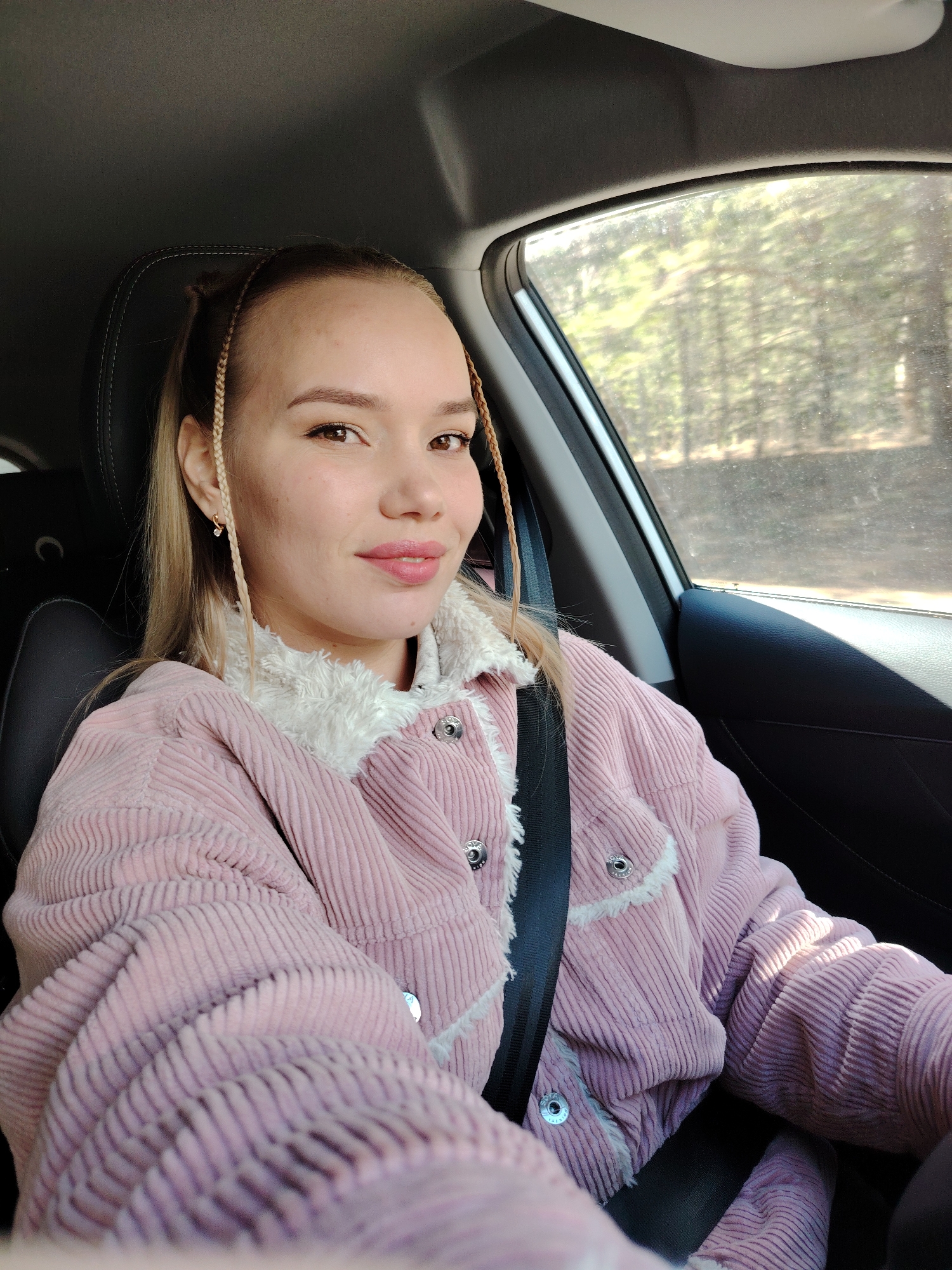 Woman takes selfie in car in Chaikovsky, Russia