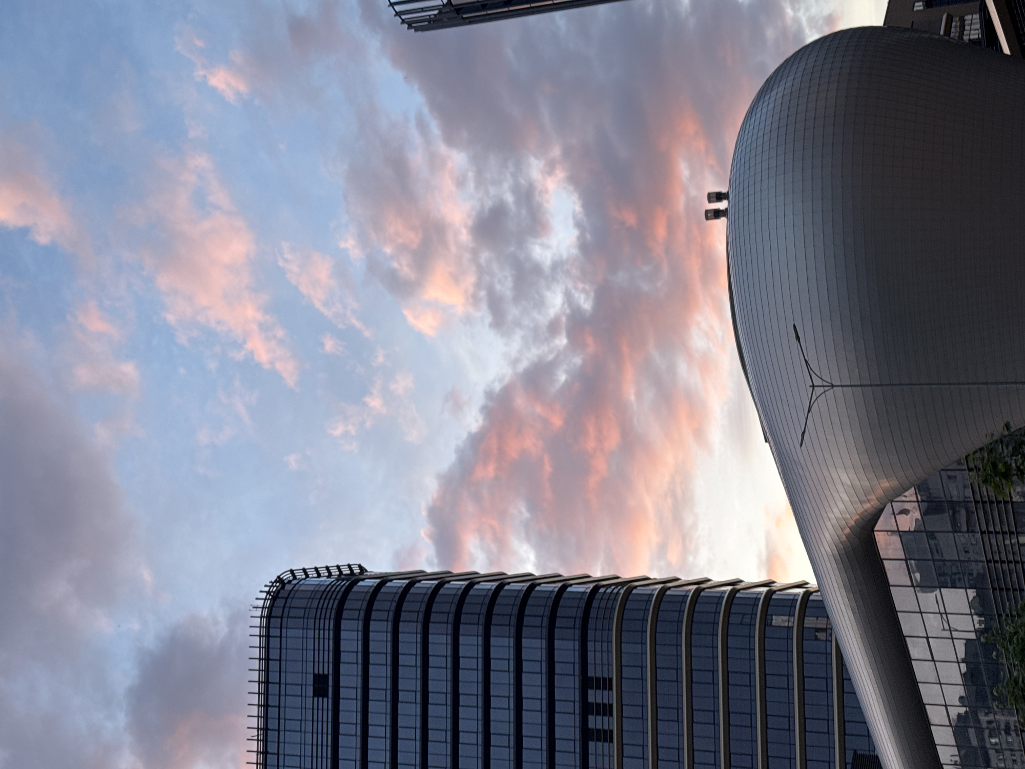 Sunset documented over modern Minsk skyline near arena complex