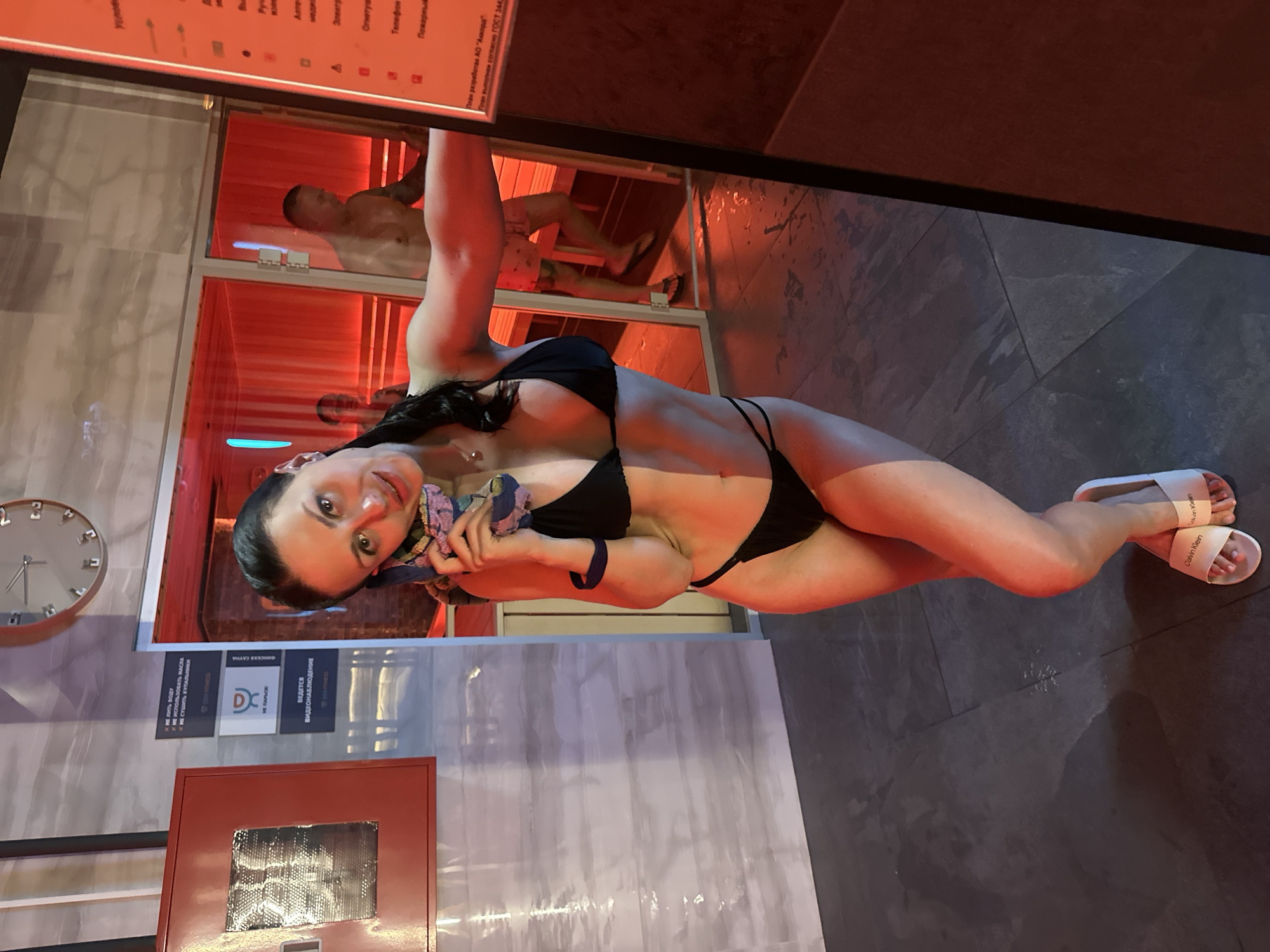 Poolside phone moment at a spa in Novoe Devyatkino