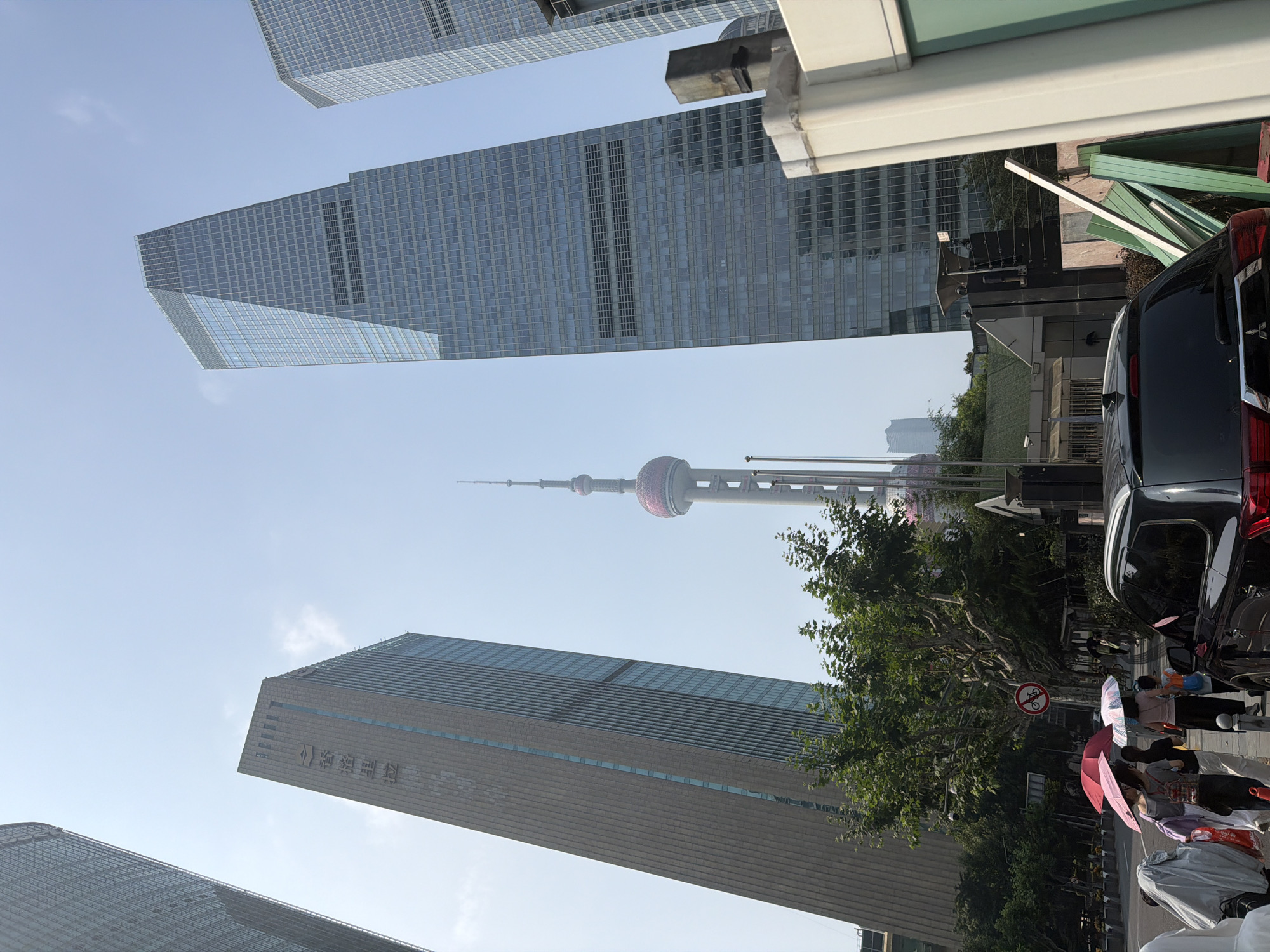 Pudong skyline and streets on a sunny July morning