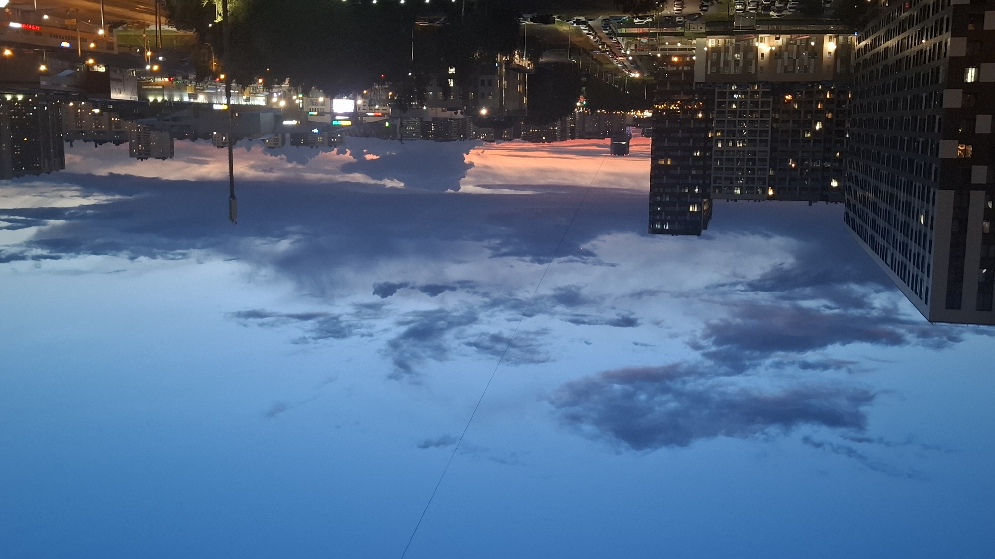 Dense smoke rises over Saint Petersburg residential area at dusk