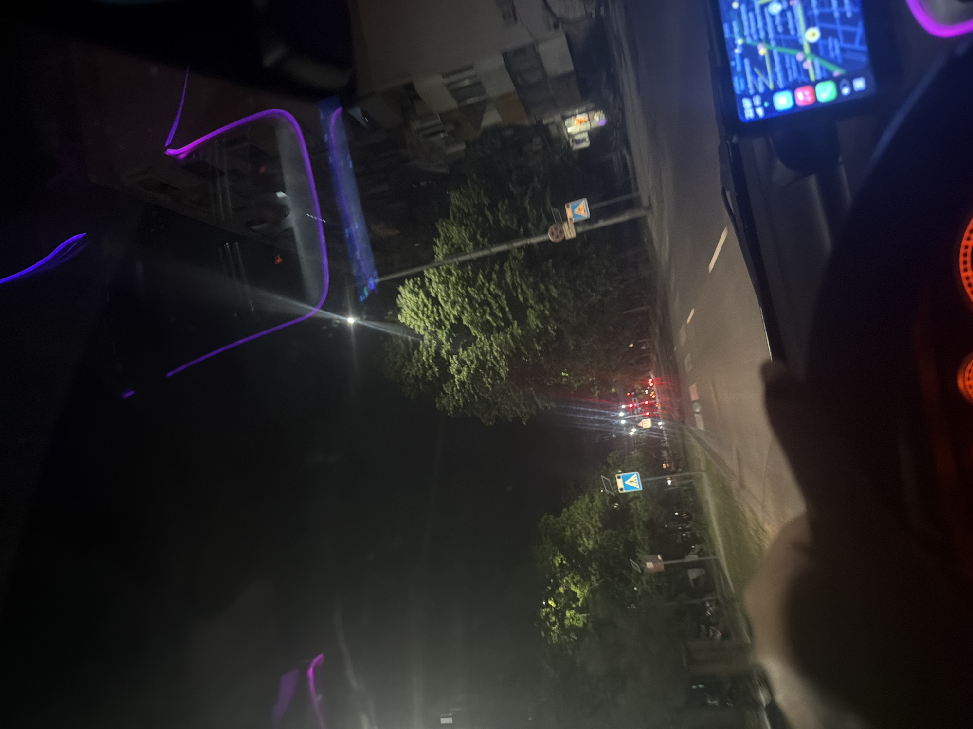 Driver navigates illuminated streets in Plovdiv using GPS system