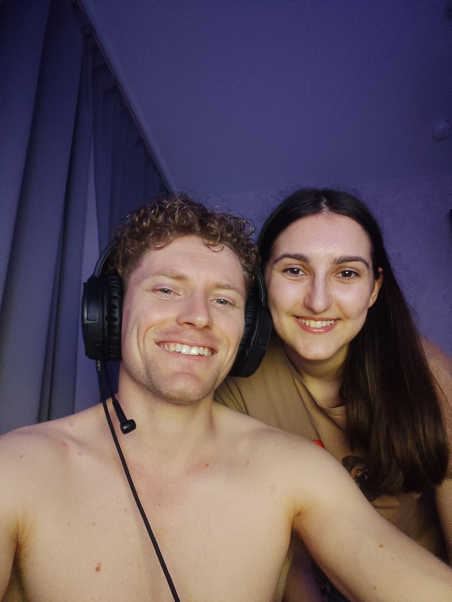 Gaming or streaming session with headphones and purple lighting