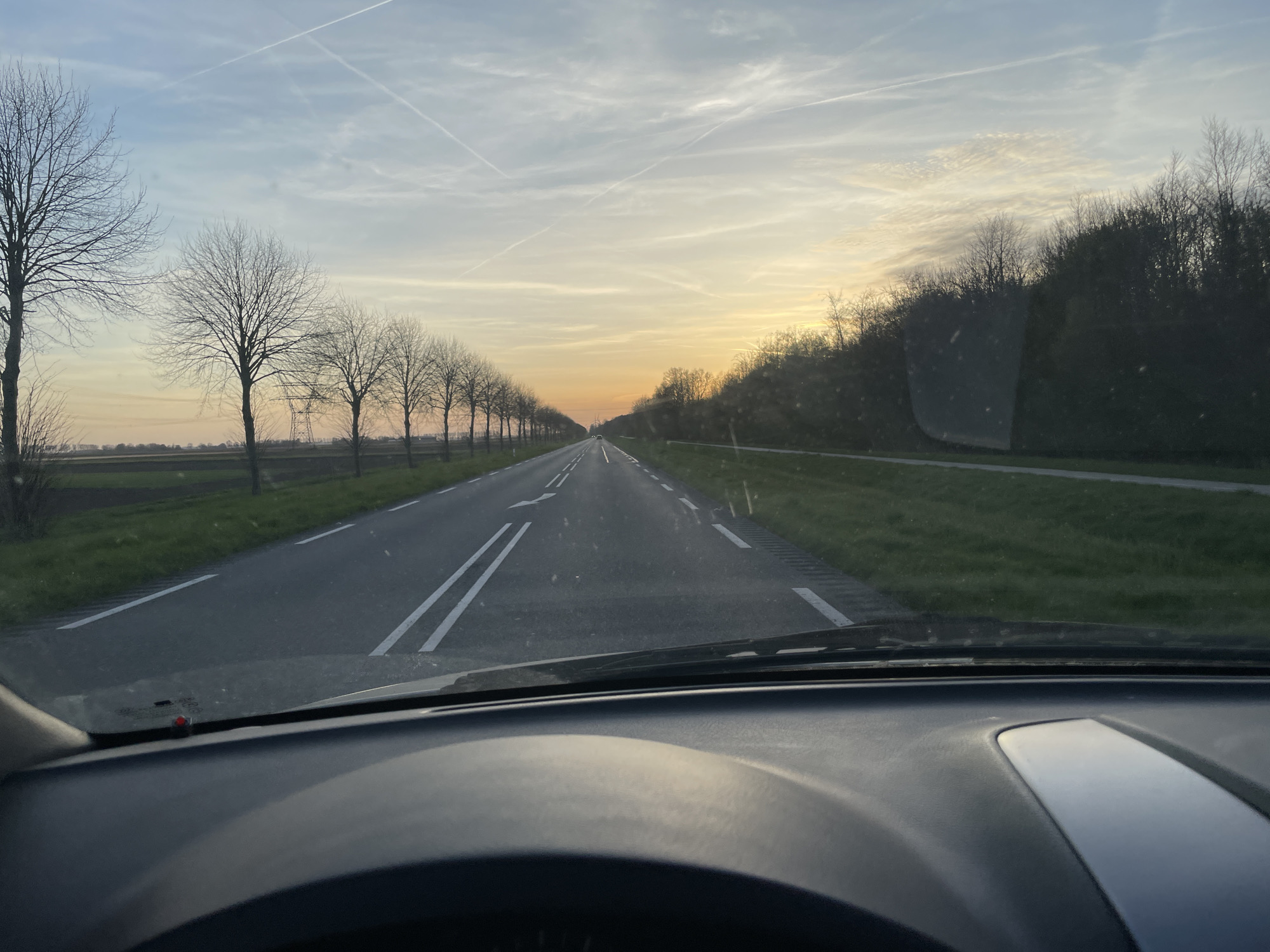 Motorist drives through Dronten on marked two-lane road