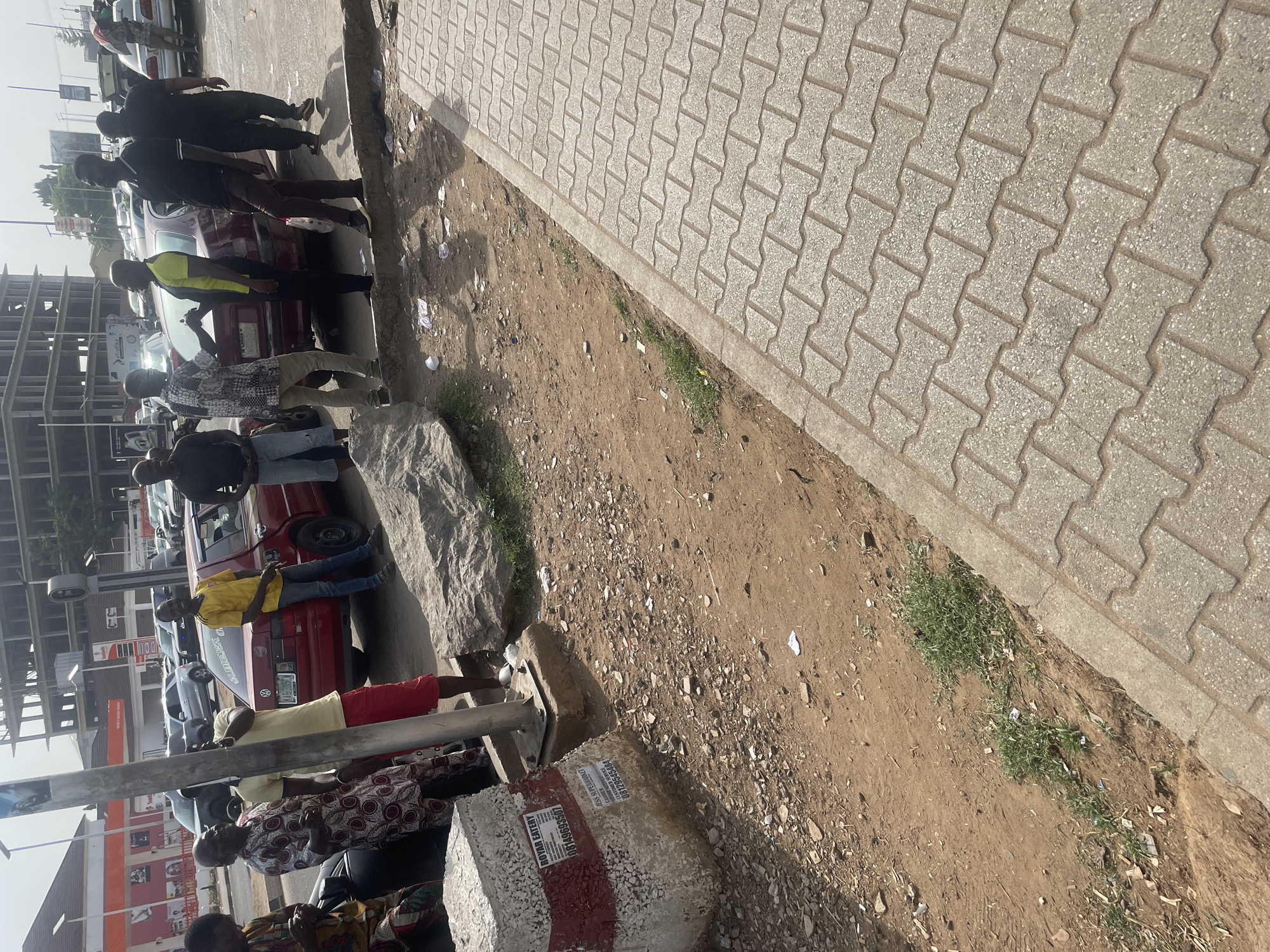 Busy street life captured in Abuja during afternoon hours