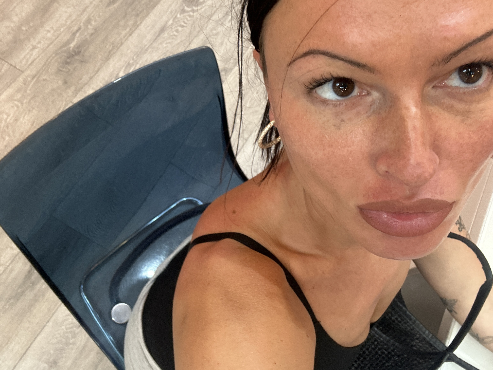 Woman selects nail polish colors in Tunbridge Wells salon