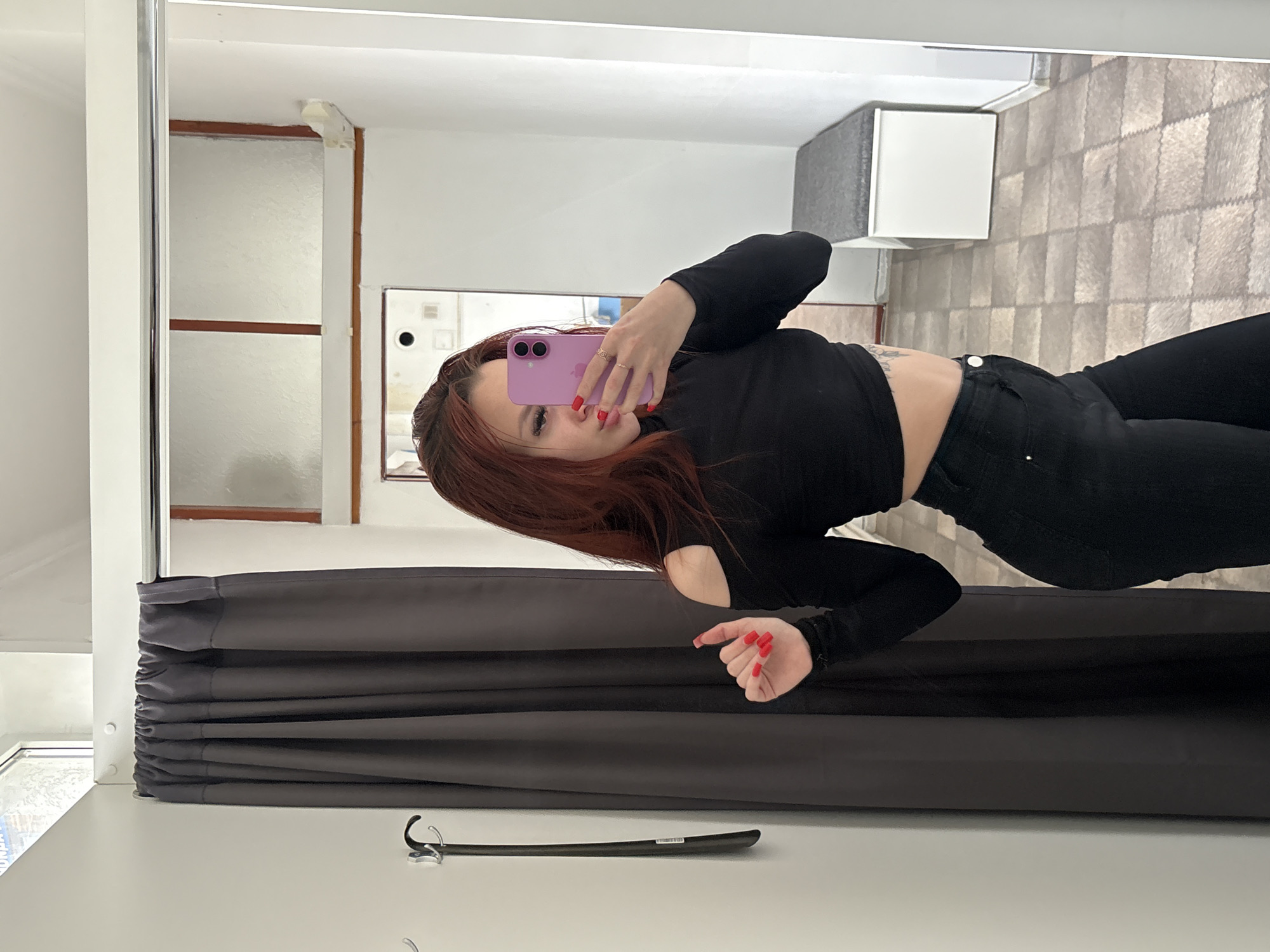 Woman takes mirror selfies in Simferopol fitting room