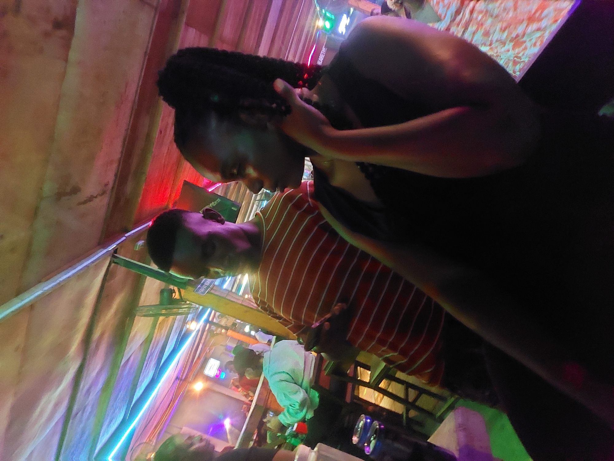 Late-night bar gathering documented in Dar es Salaam