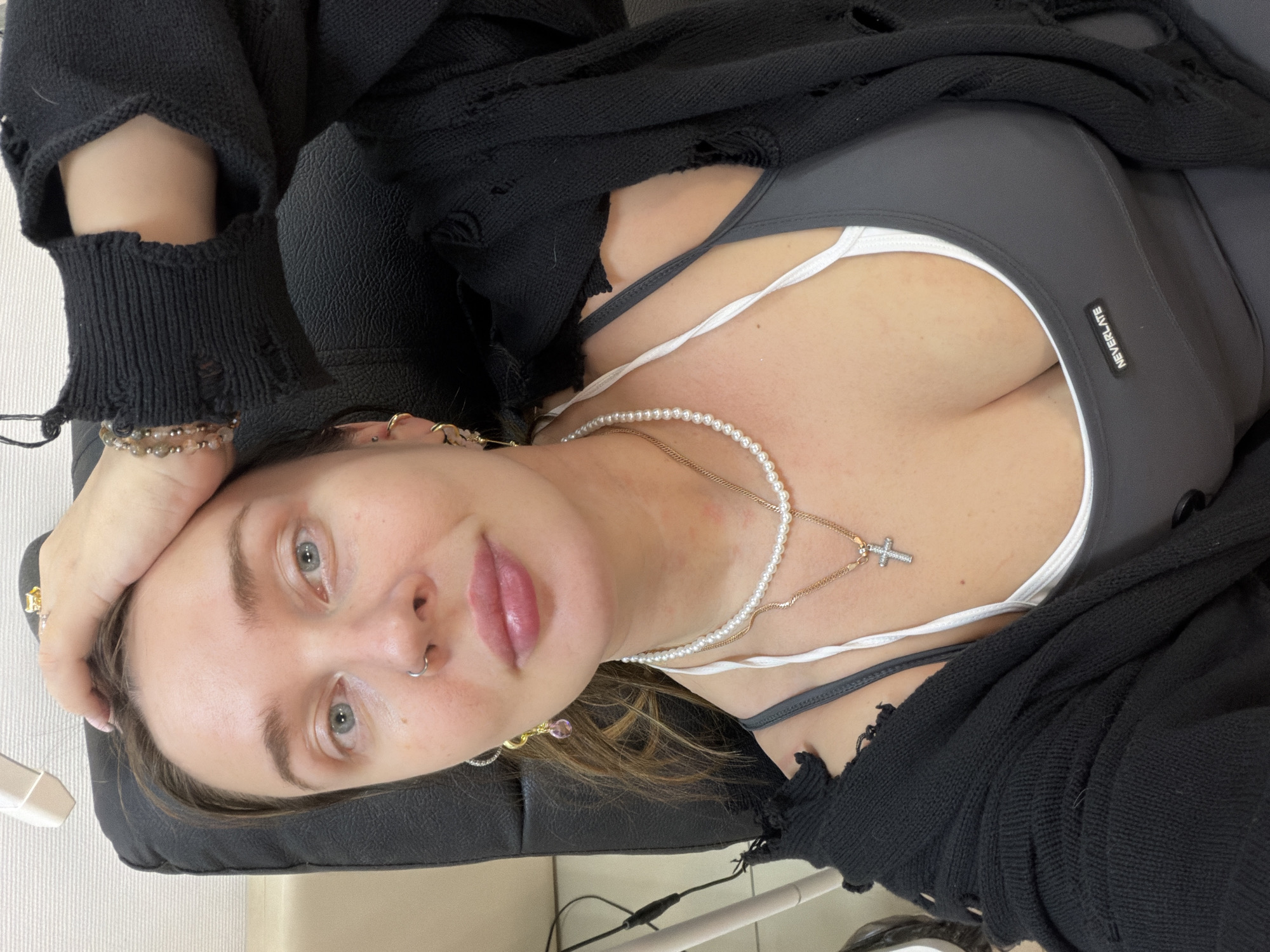 Woman takes selfies in indoor spaces in Chaikovsky, Russia
