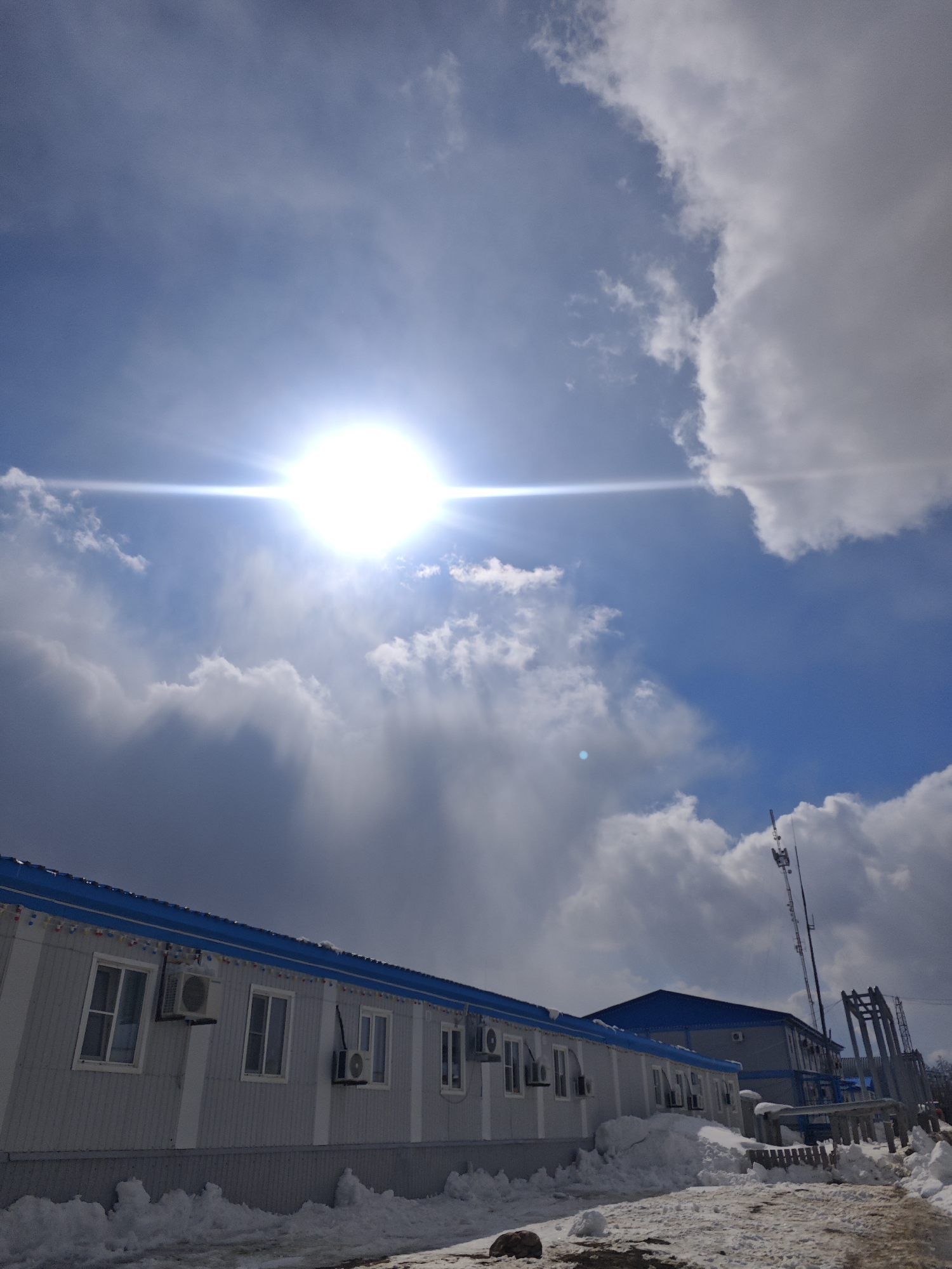 Sunny day at Russian industrial facility amid snow