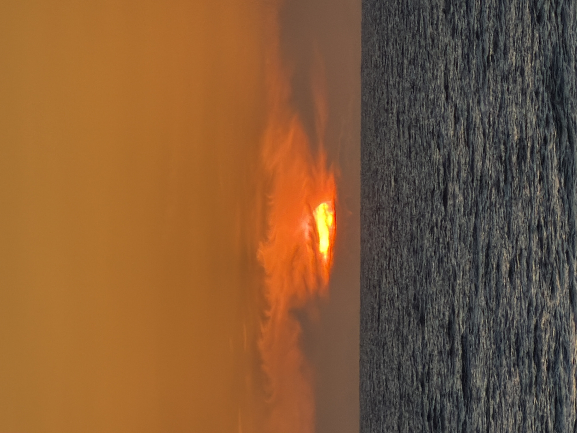 Hazy orange skies with obscured lighting observed in Tel Aviv