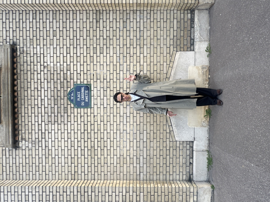 Young man documents afternoon photo session near Paris architecture