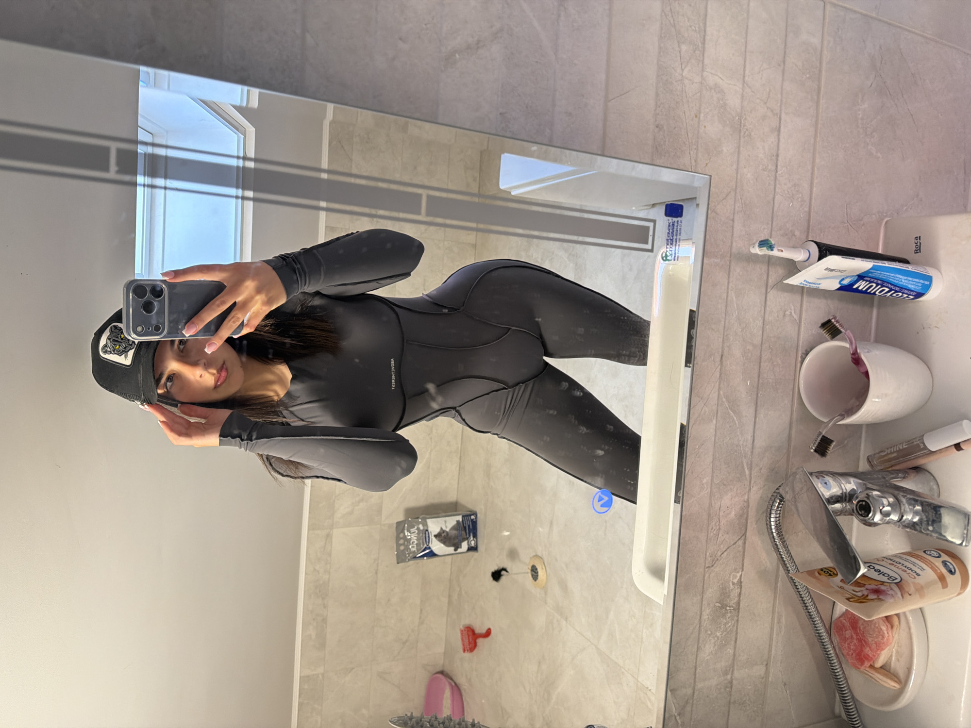 Person takes bathroom mirror selfies in Gabrovo, Bulgaria