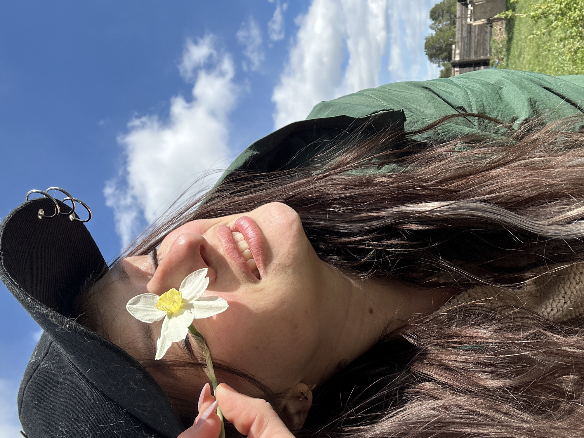 Woman photographs spring flower session in rural Russia