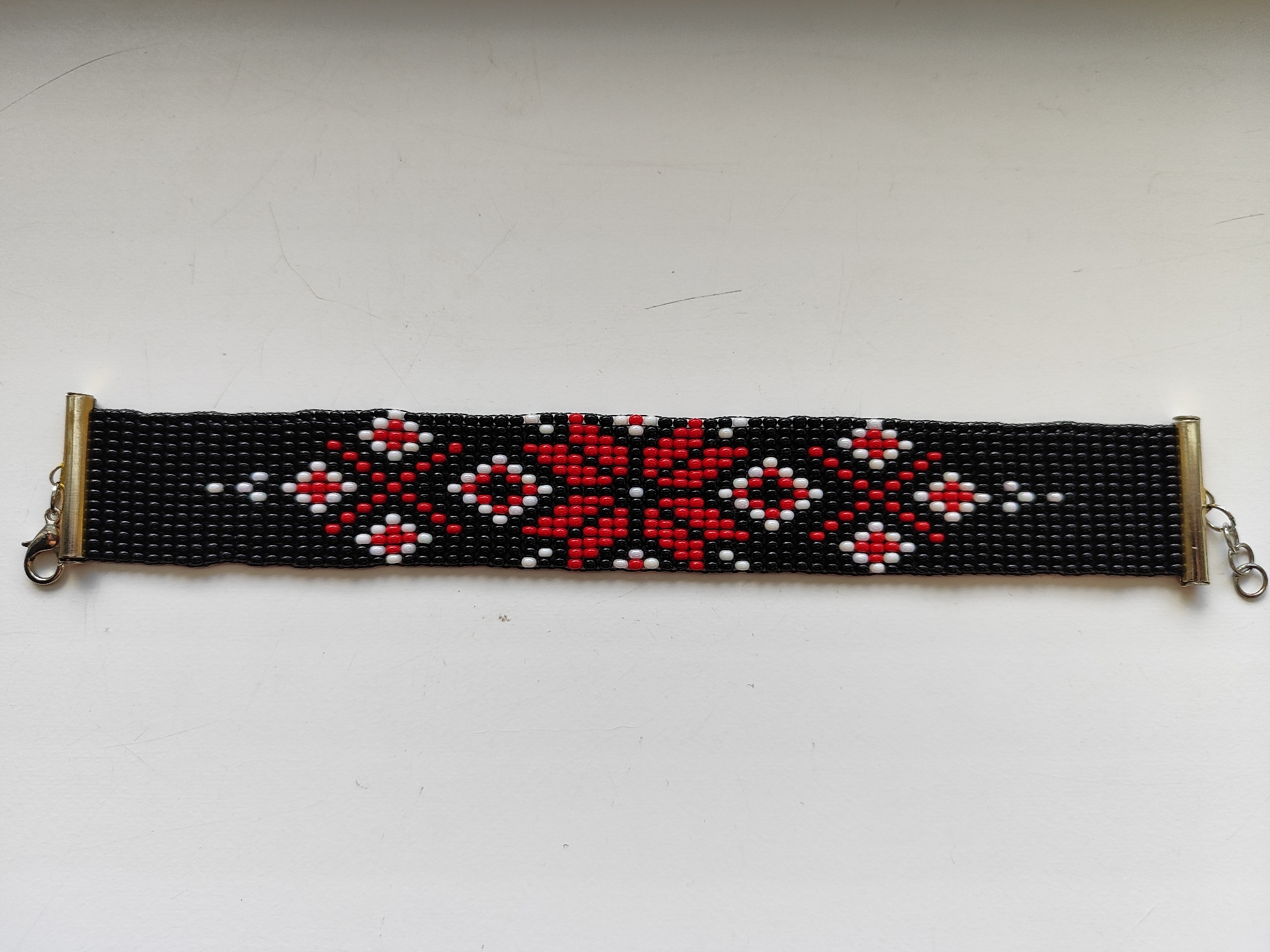Everyday objects documented: bracelet, flowers, candy wrapper