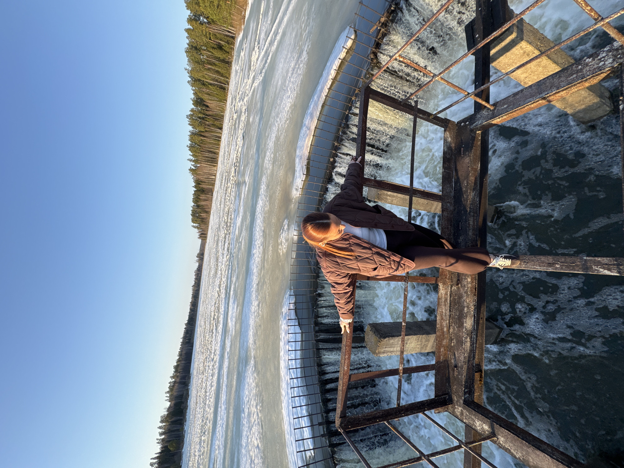 Person stands on metal platform over water in Rusalevka