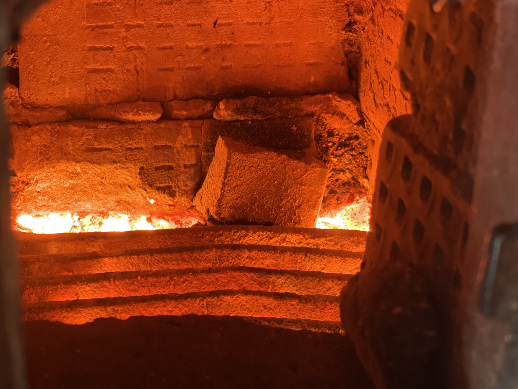 Brick structure interior with tiered steps documented in Zhigalki