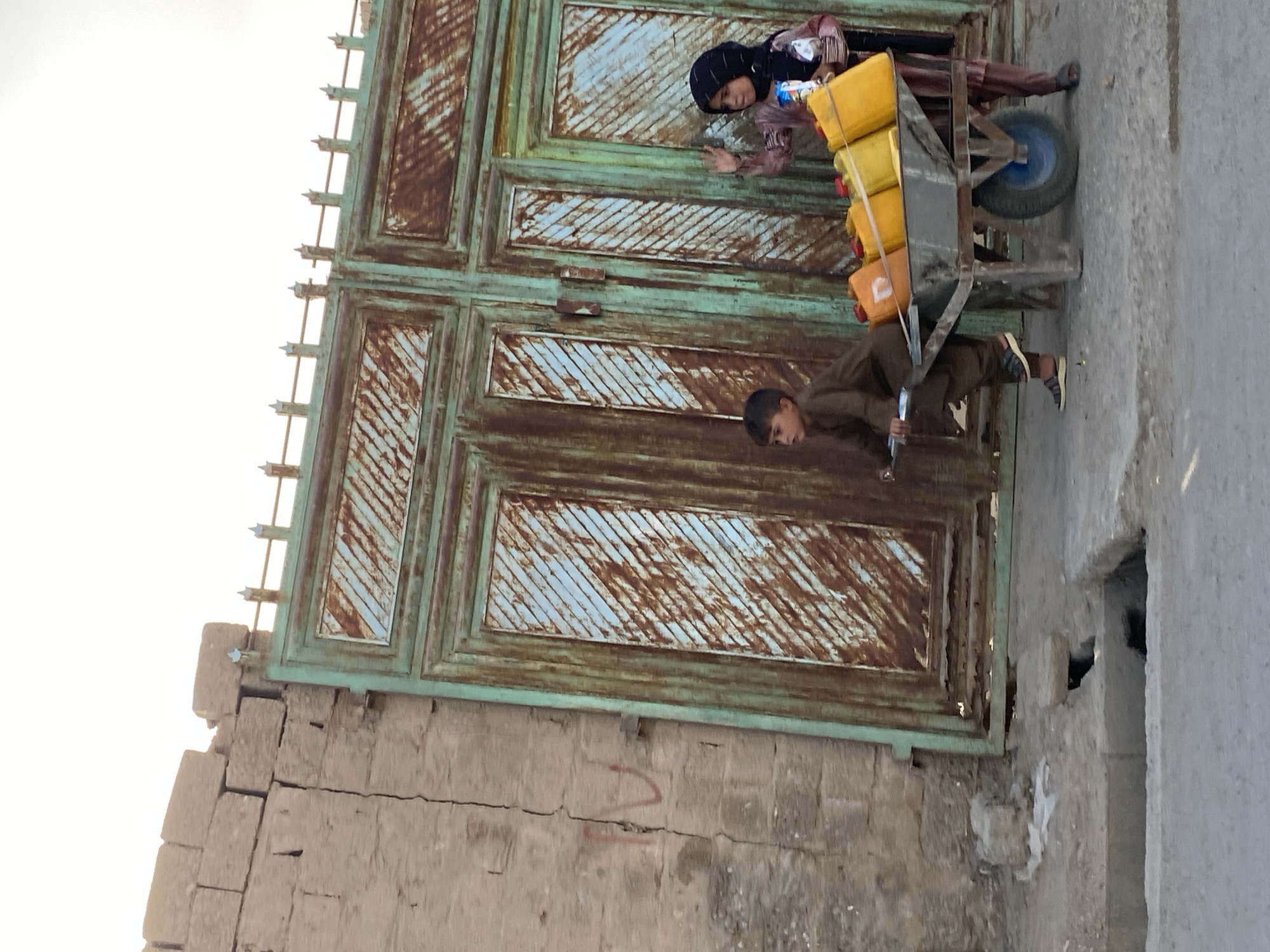 Daily life on Kandahar's streets, jerrycans and dusty roads