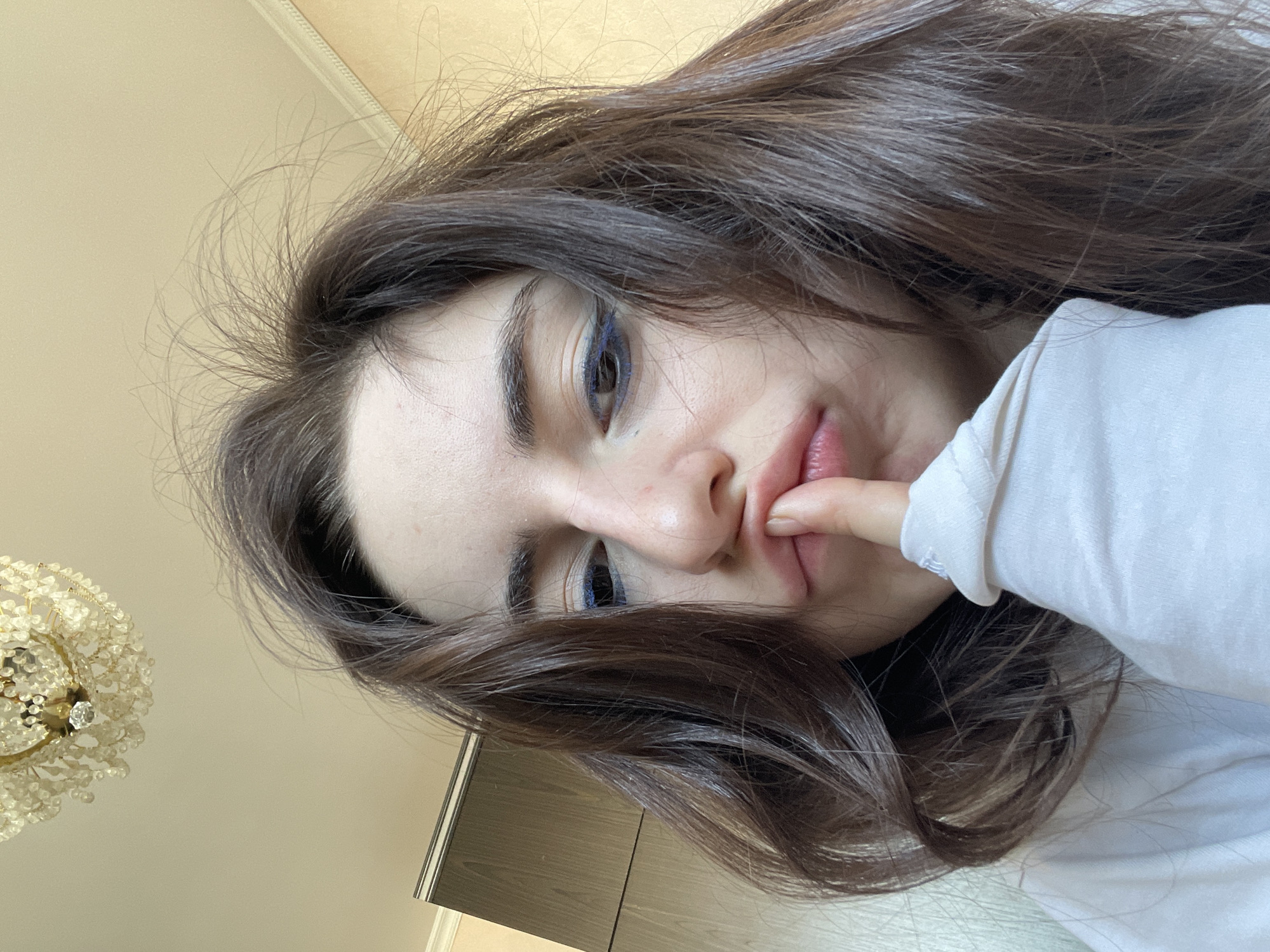 Young women take morning selfies in Moscow apartments