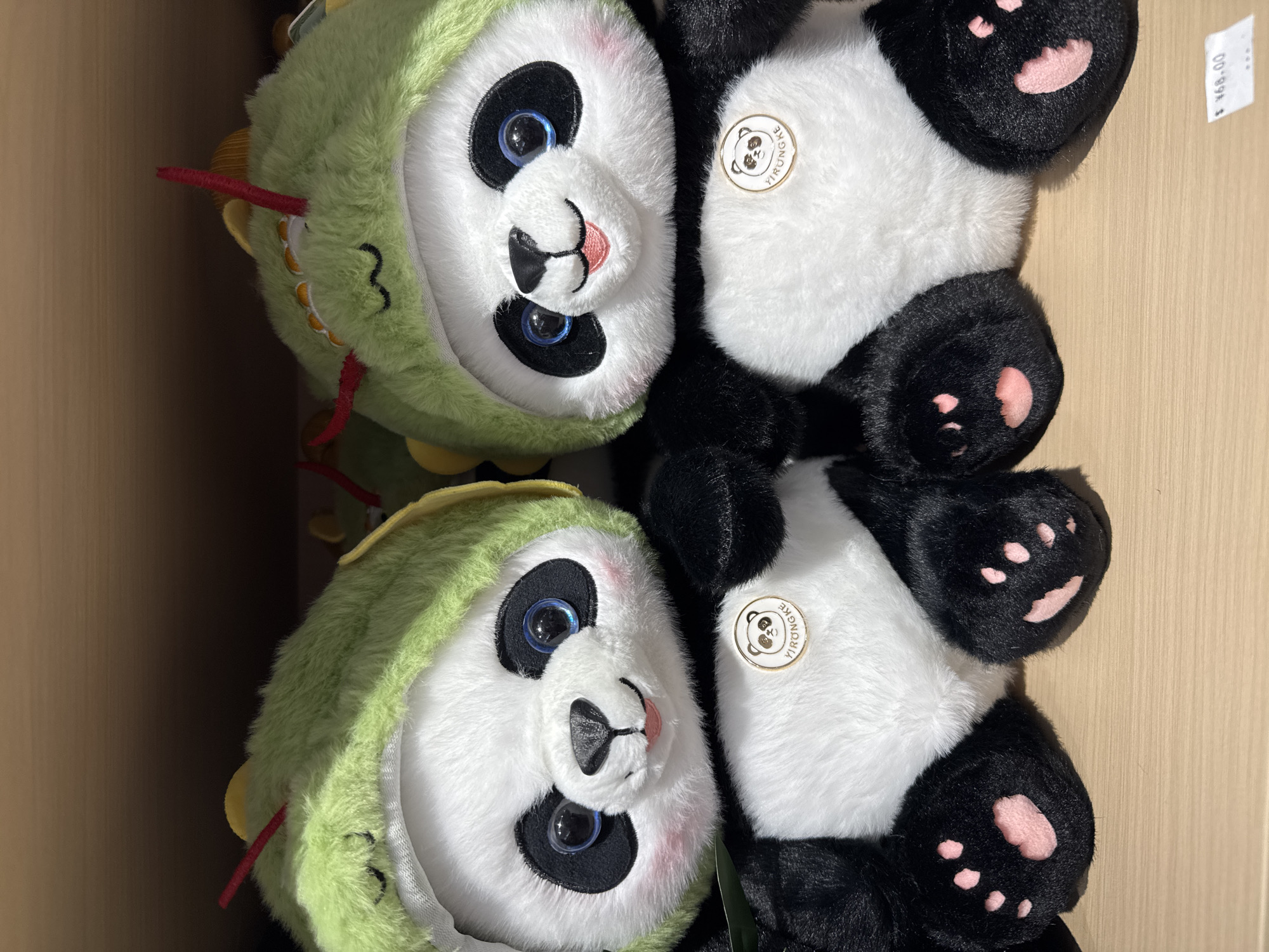 Panda plush toys with dragon costumes spotted for sale