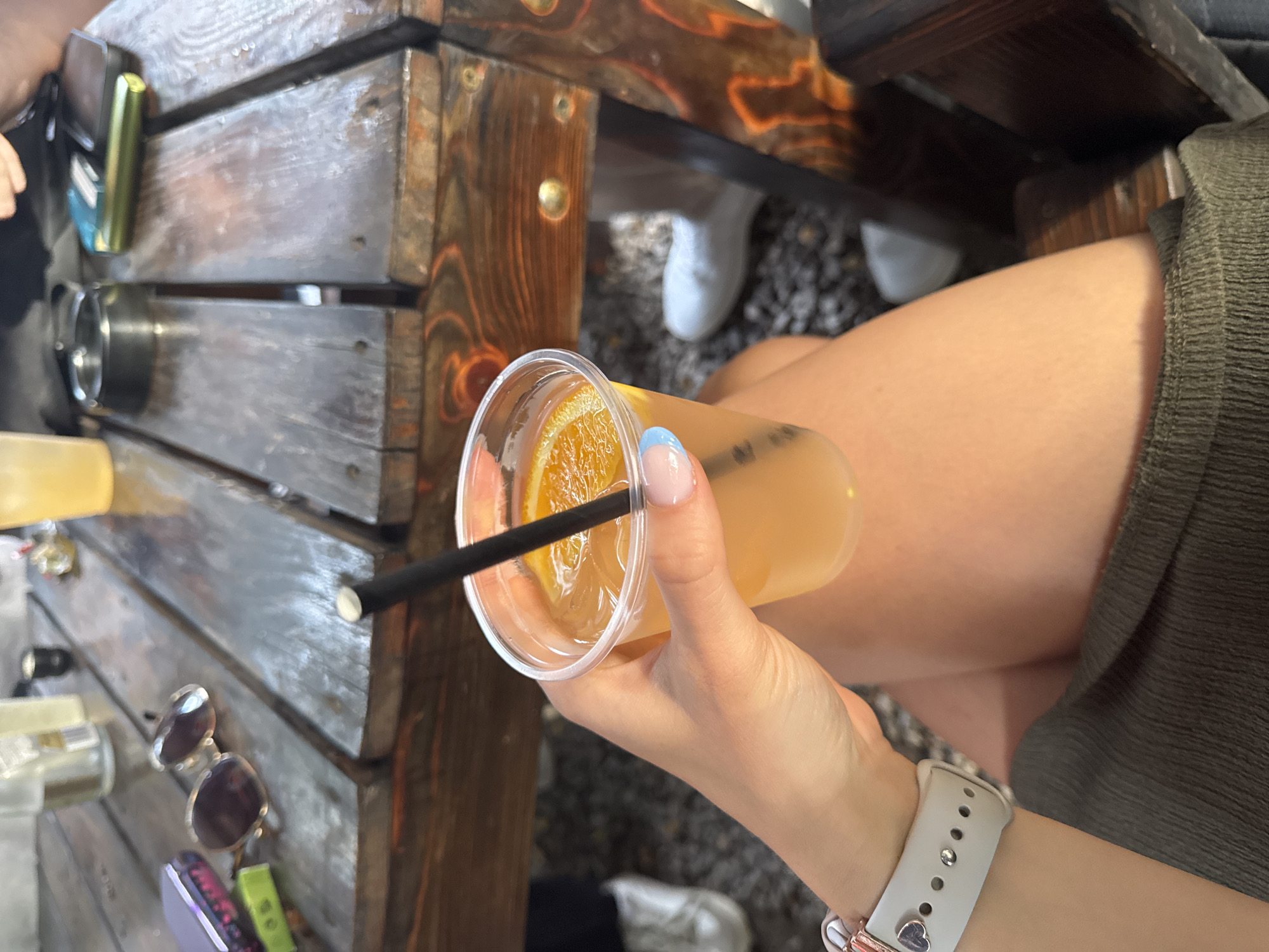 Outdoor festival in Sofia's pine trees with drinks and a stage