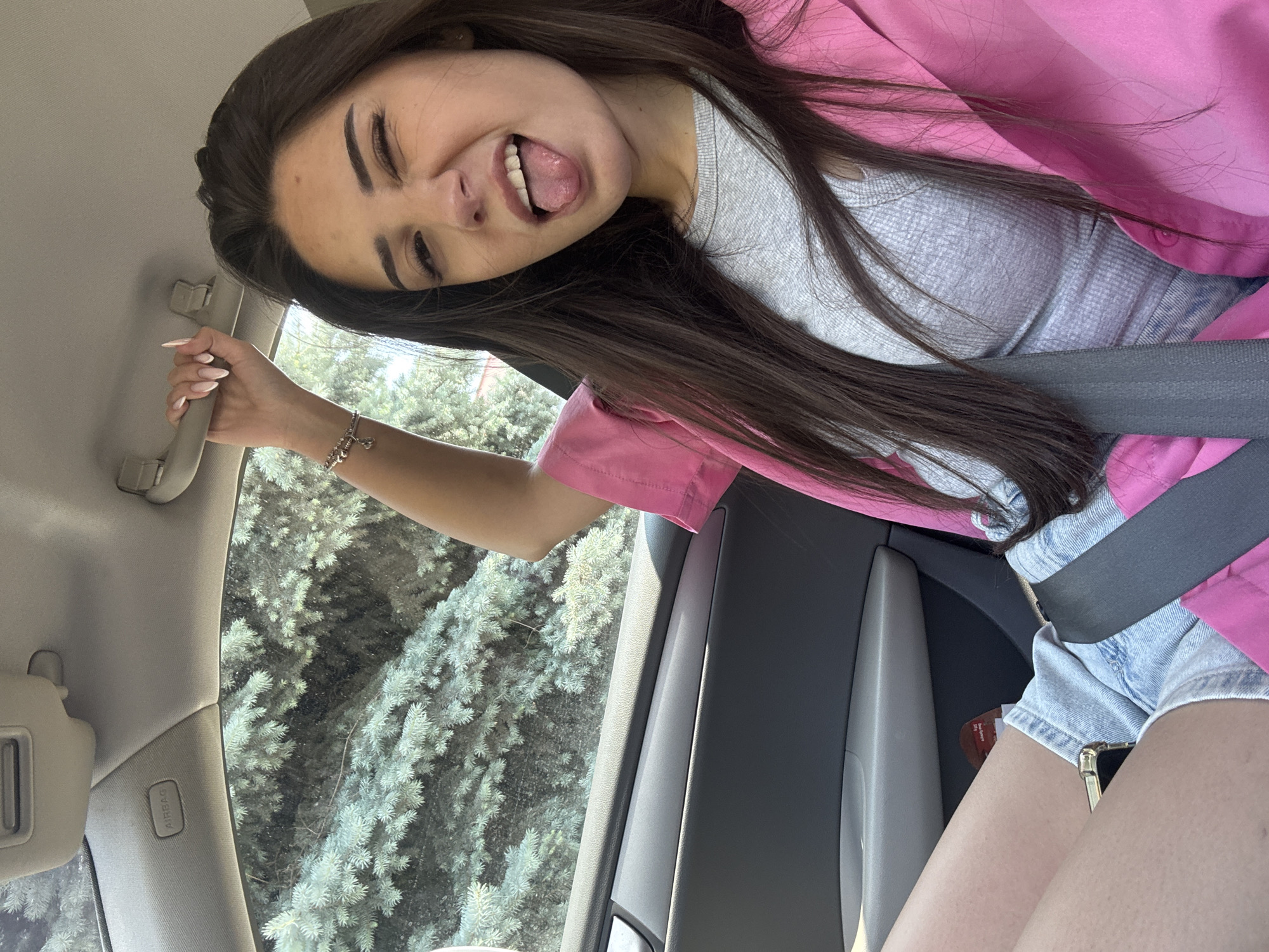 Woman takes playful car selfies in Plovdiv Bulgaria