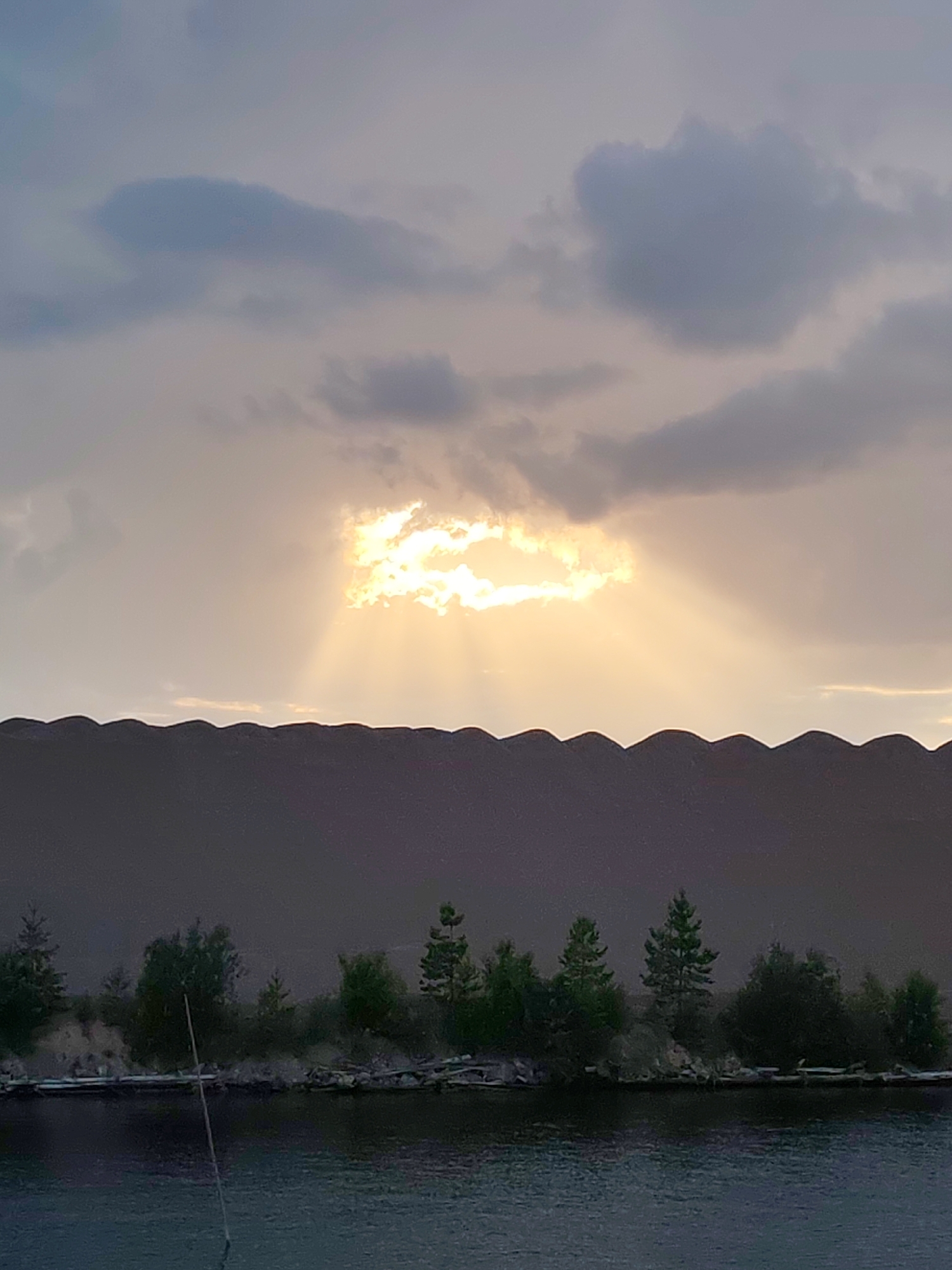Quarry, barge, and dusk light at Kvartsitny, Russia