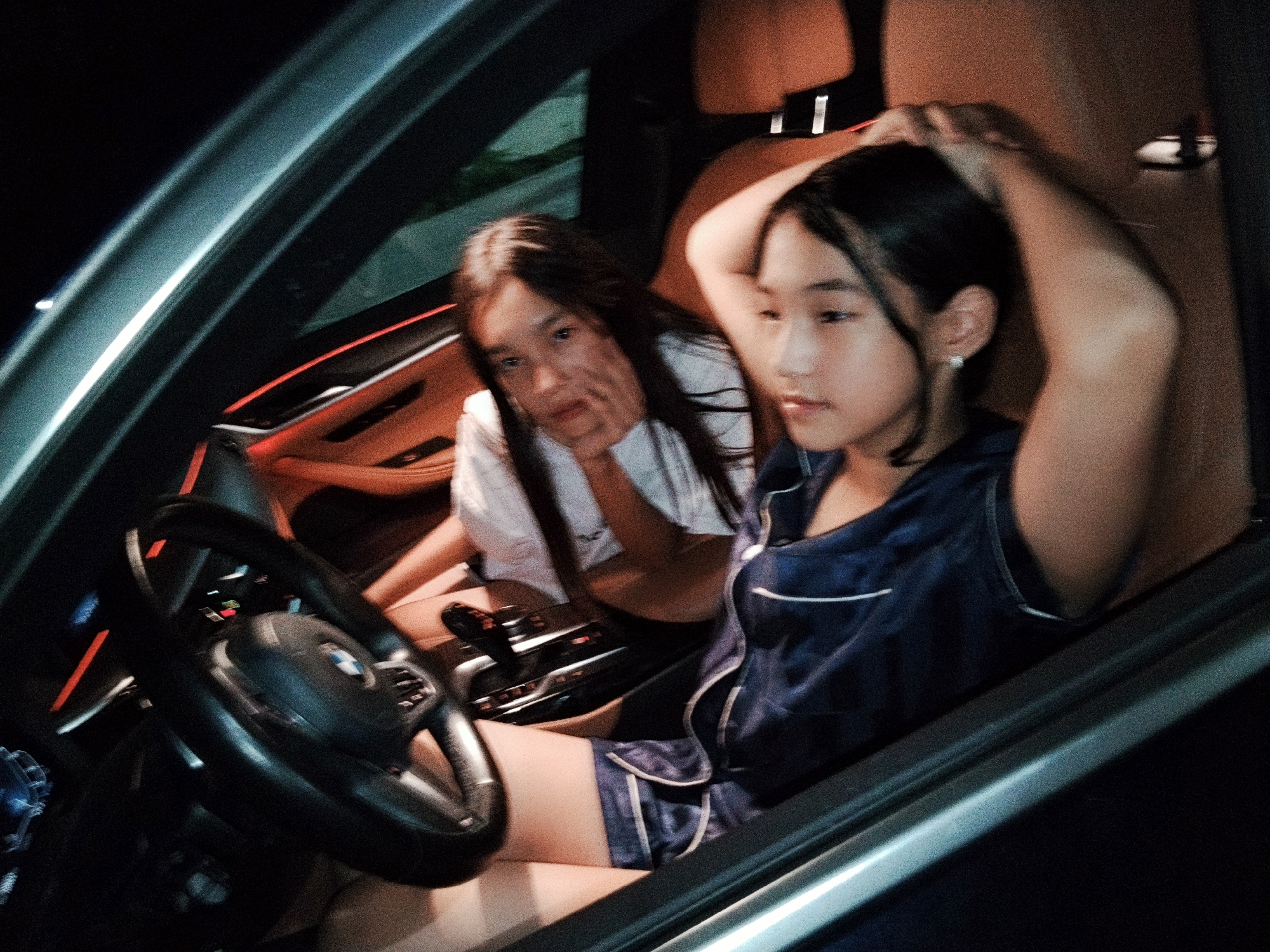 Group hanging out inside a car in Koçkor-Ata, Kyrgyzstan