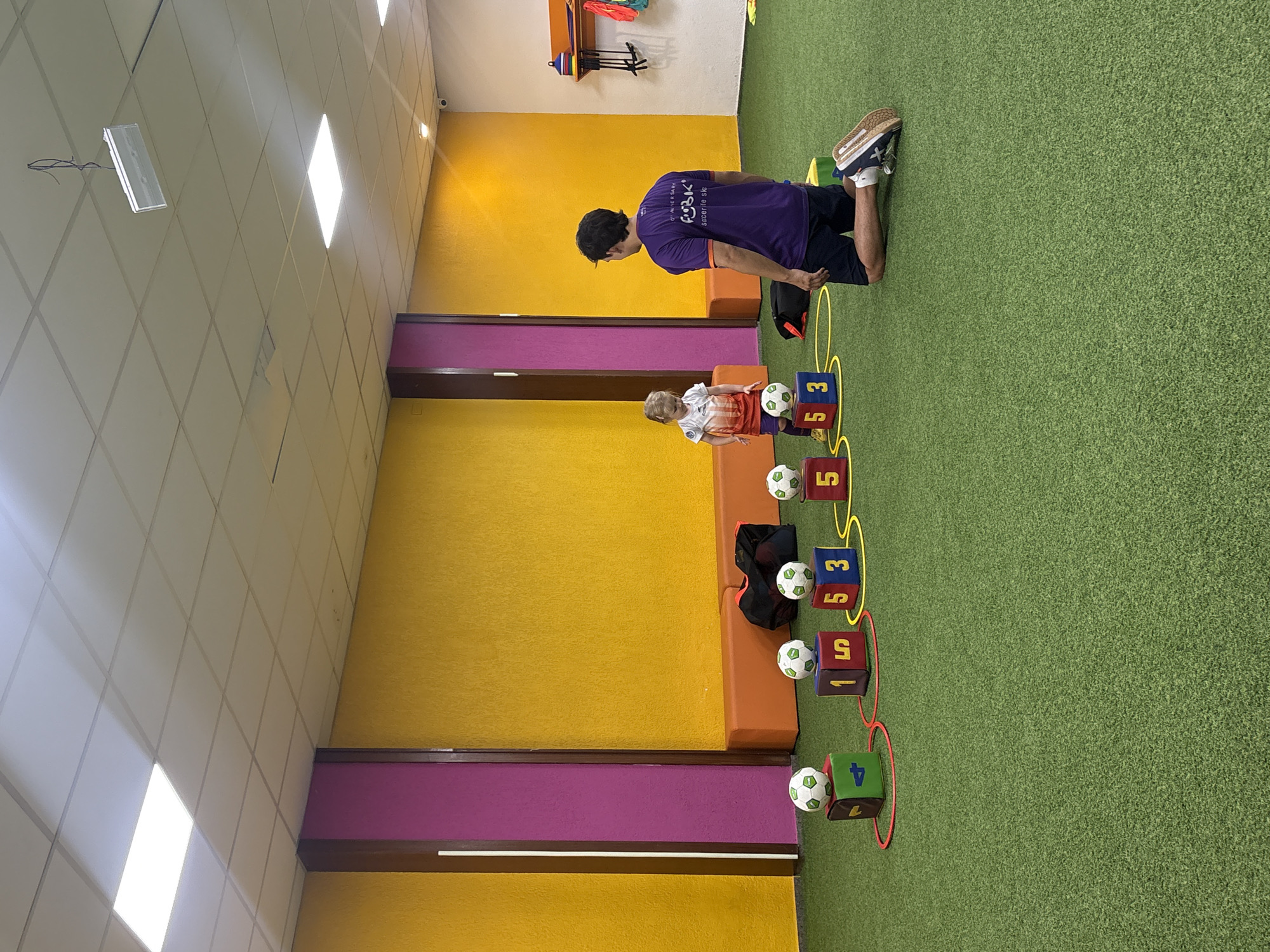 Little kid soccer training session at a Valencia indoor facility